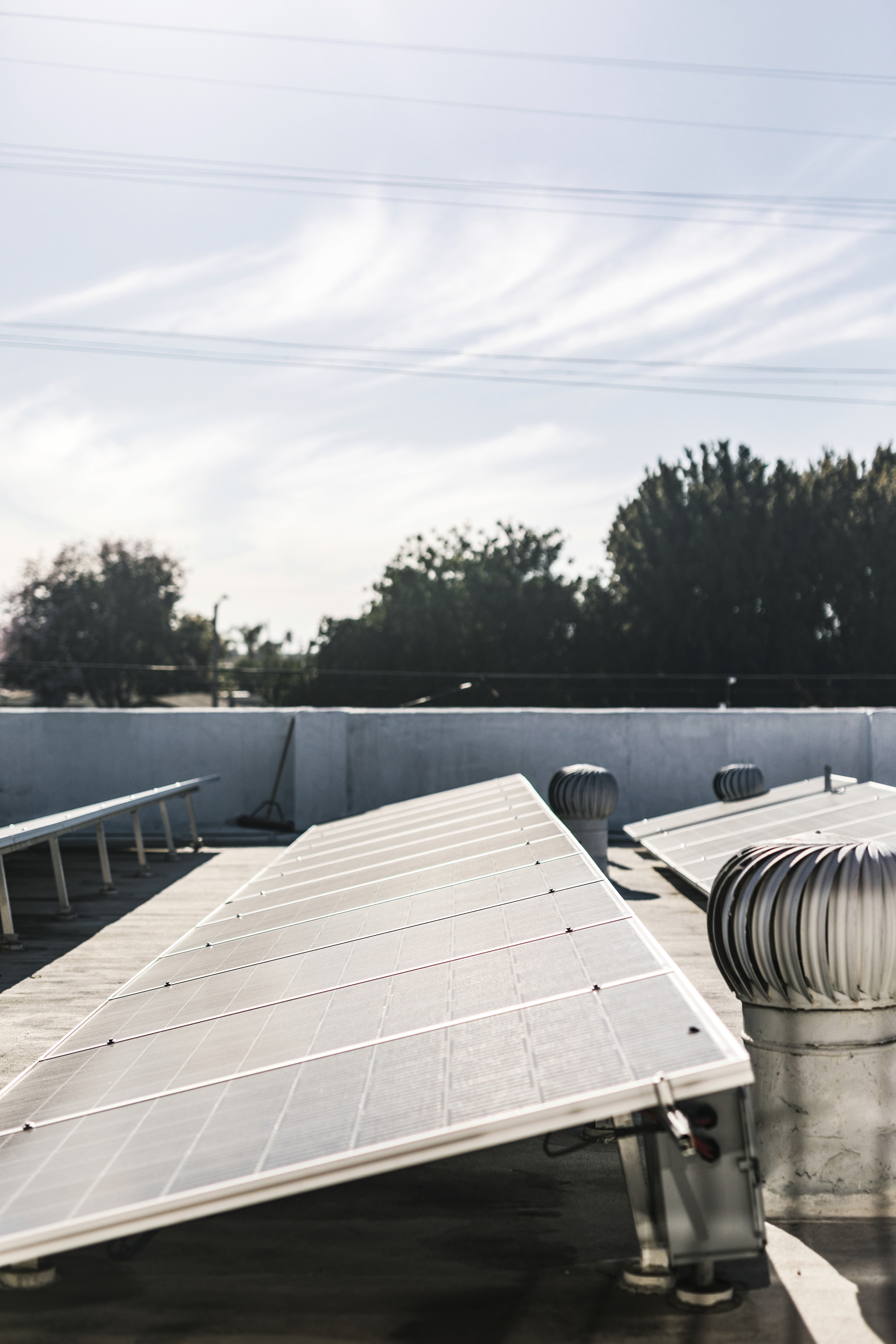 person in red sweater holding babys hand