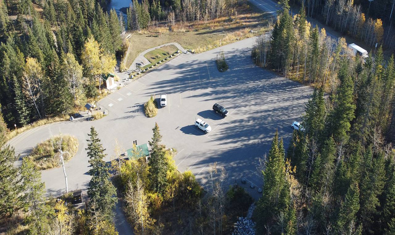Aerial view of Canoe Meadows day use area showing parking facility and landscaped pathways in autumn