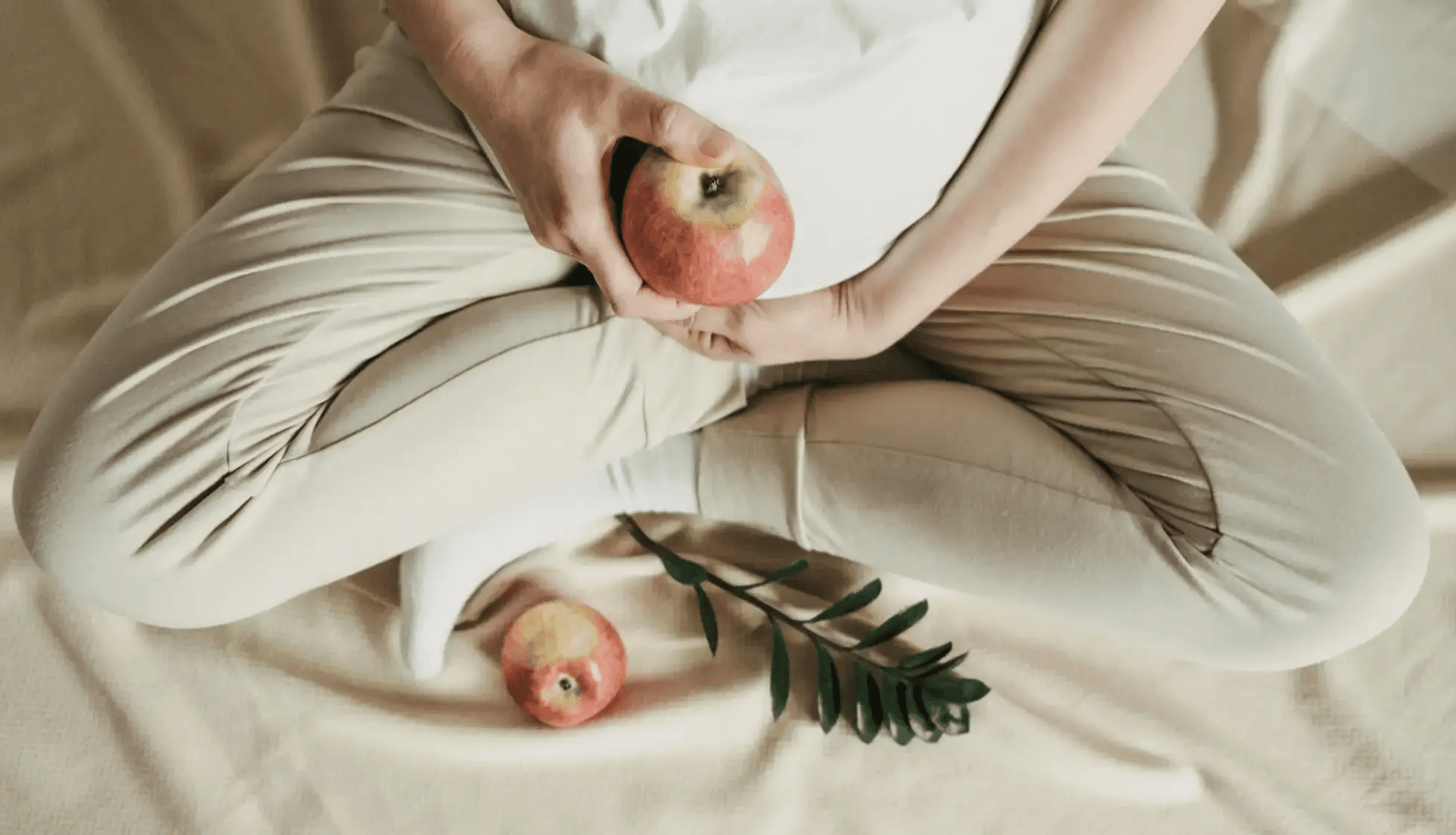 woman wearing gray long-sleeved shirt facing the sea