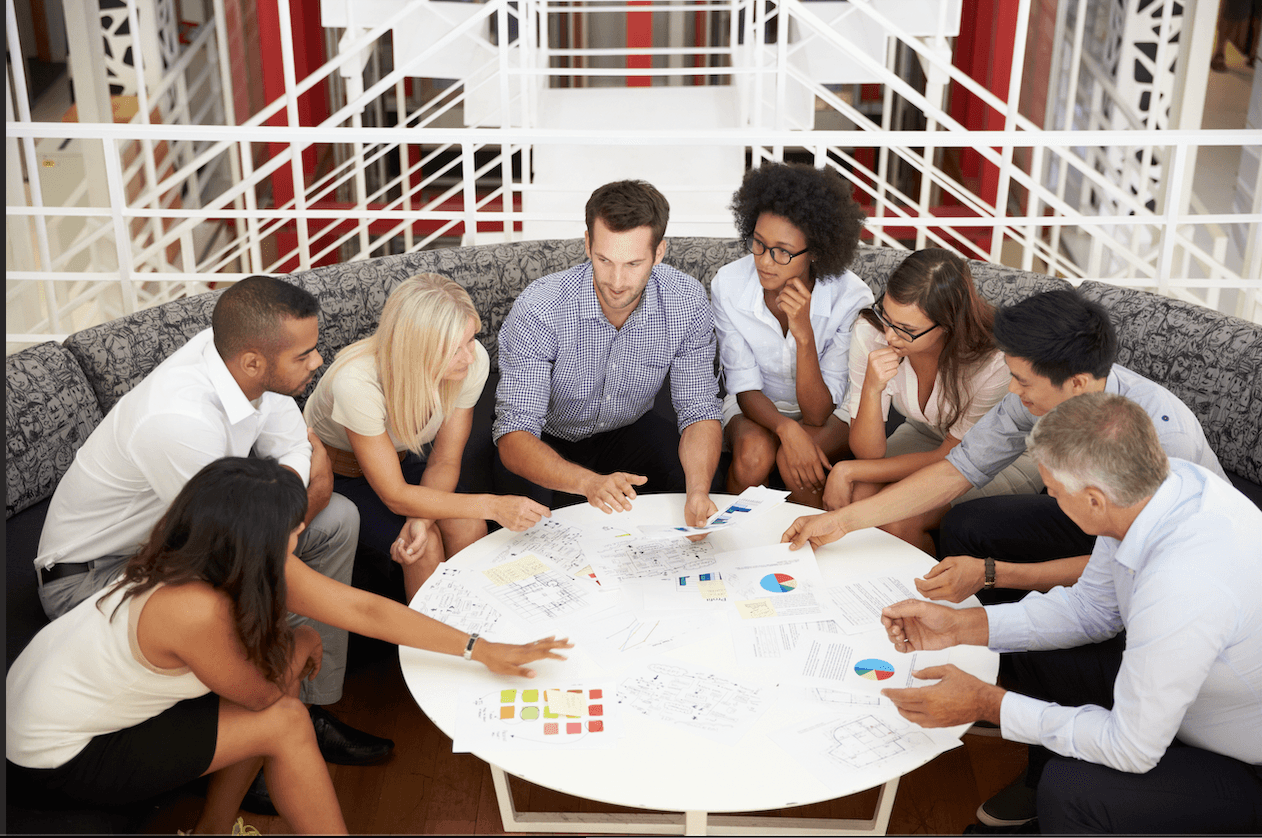 A team listening to a leader fully engaged