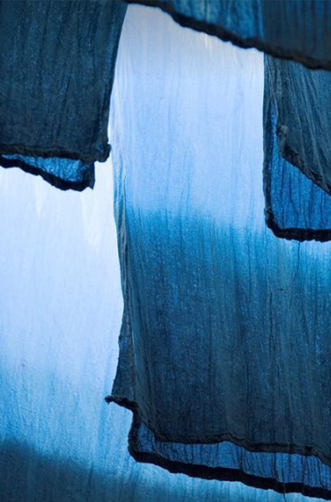 Hand-dyed indigo fabric drying in natural light – artisanal inspiration for Indigo Estate Atelier Bali villas