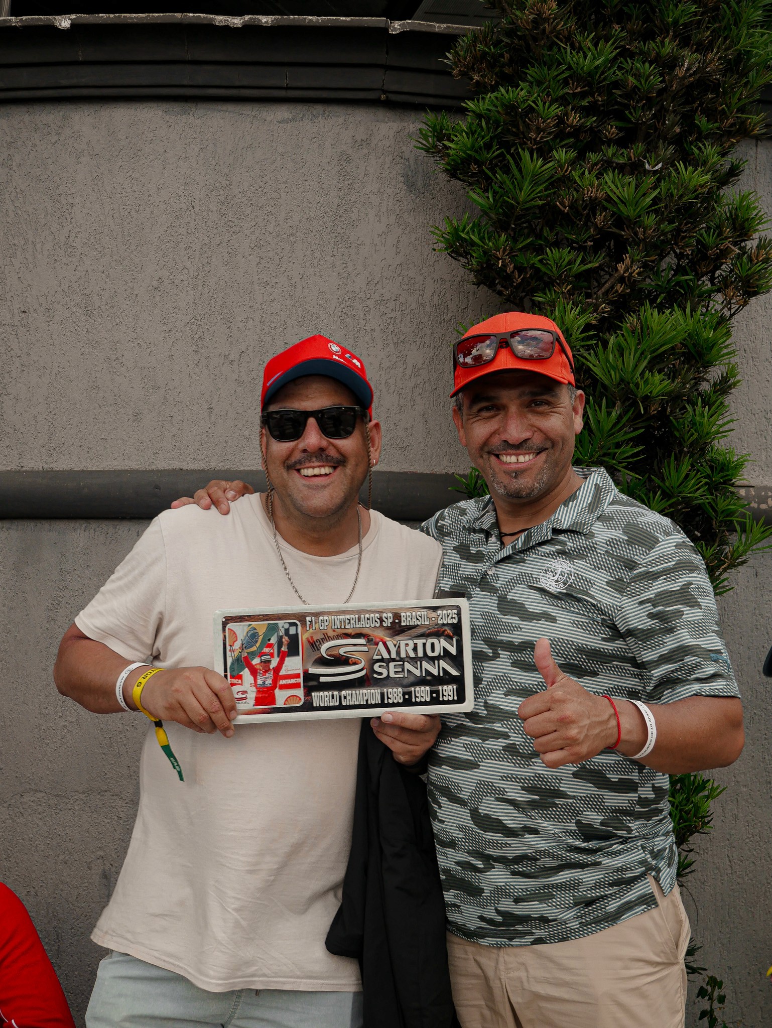 three people sitting in front of table laughing together