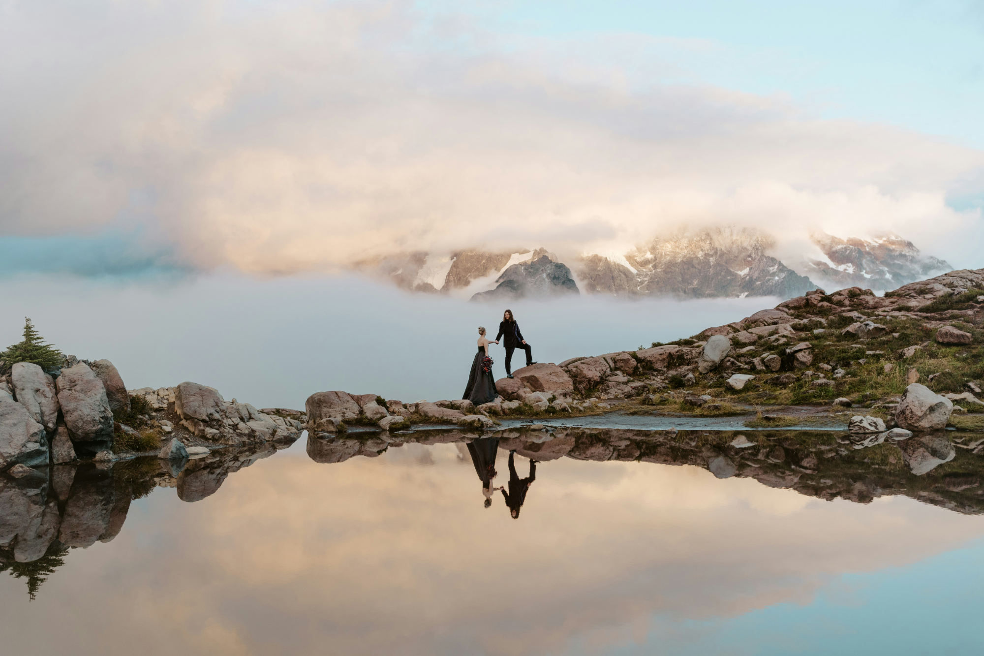 An epic photo of a couple next to the ocean