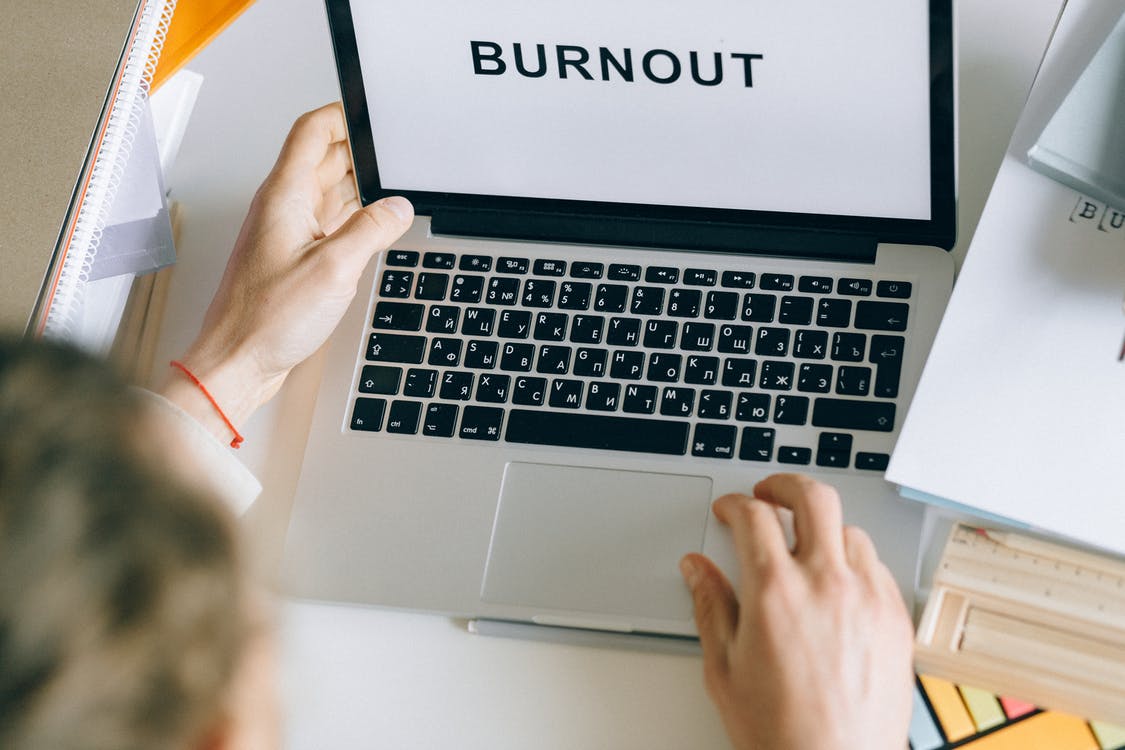 A computer showing the text burnour
