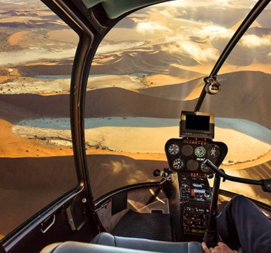 Helicopter flying over the Namib desert