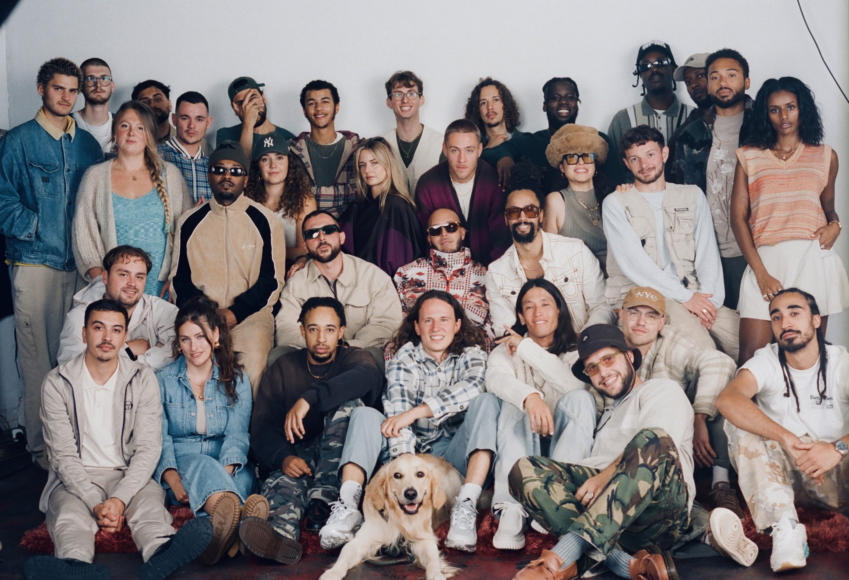 Group photo of Root 73 artists and creatives.