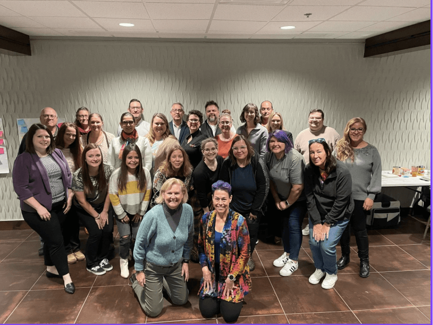 Closing photo for a leadership development cohort, a group of attendees gathered