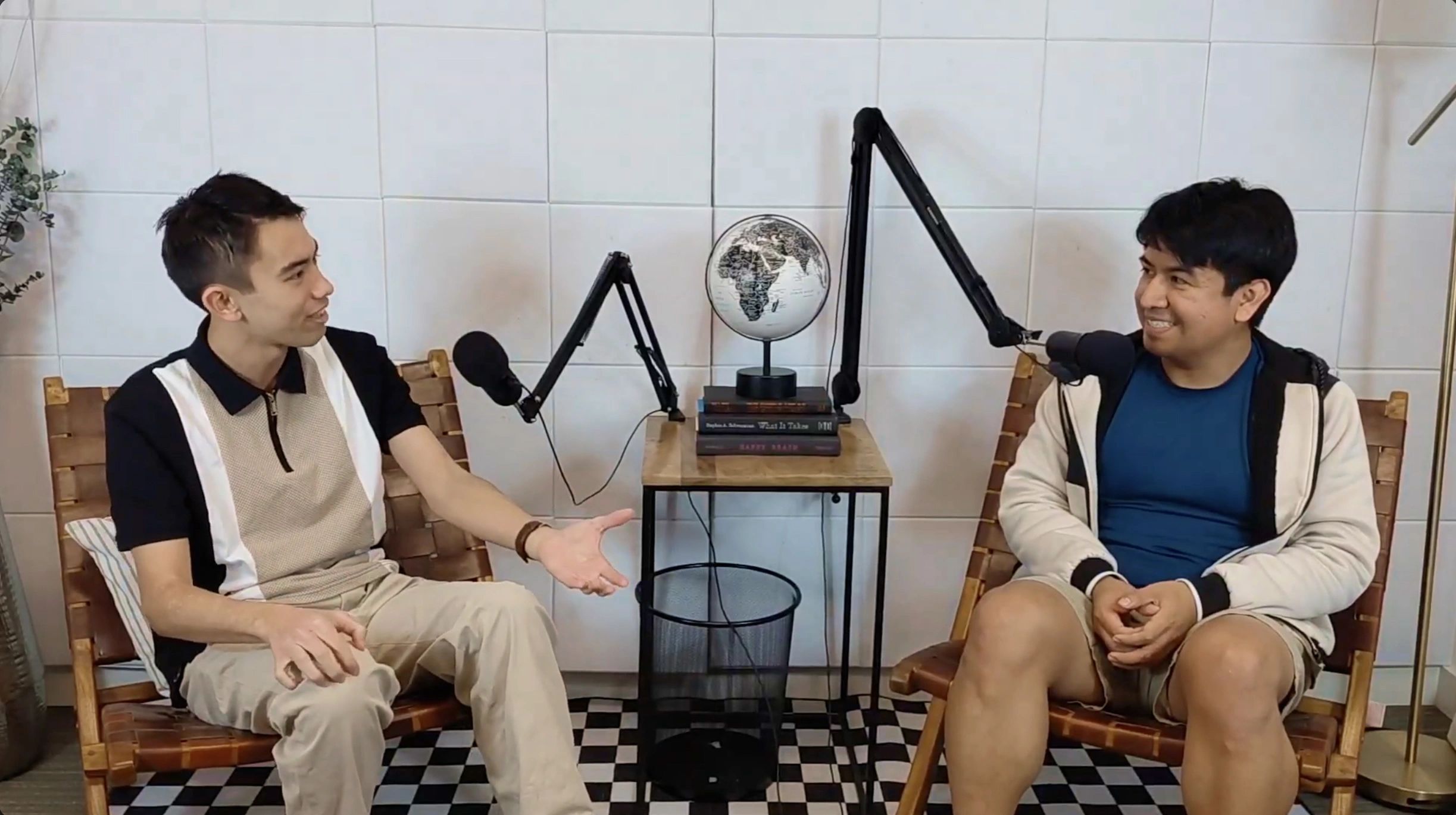 a black and white living room with a large tv