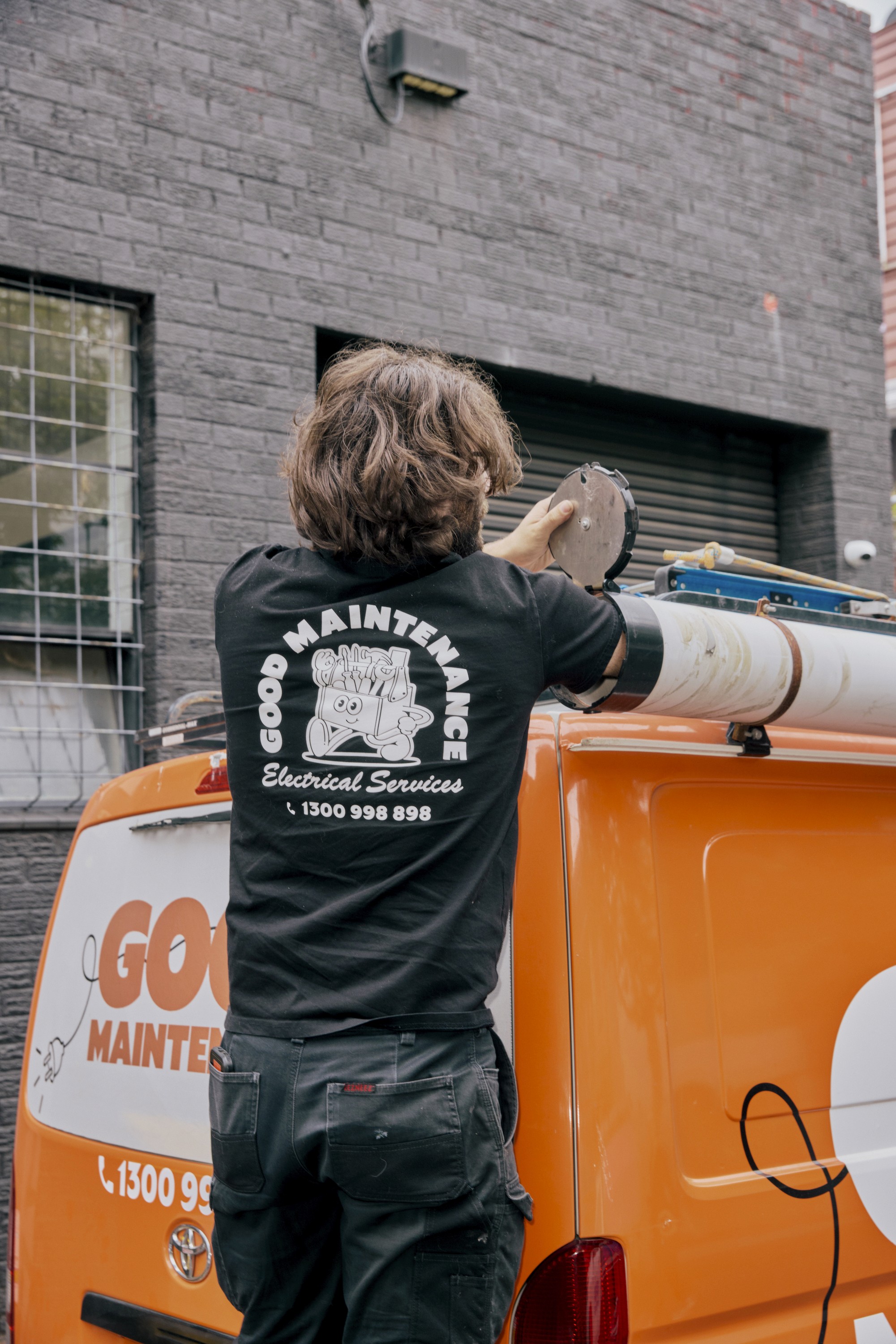 Team Member weaing a Late Night Servicing shirt