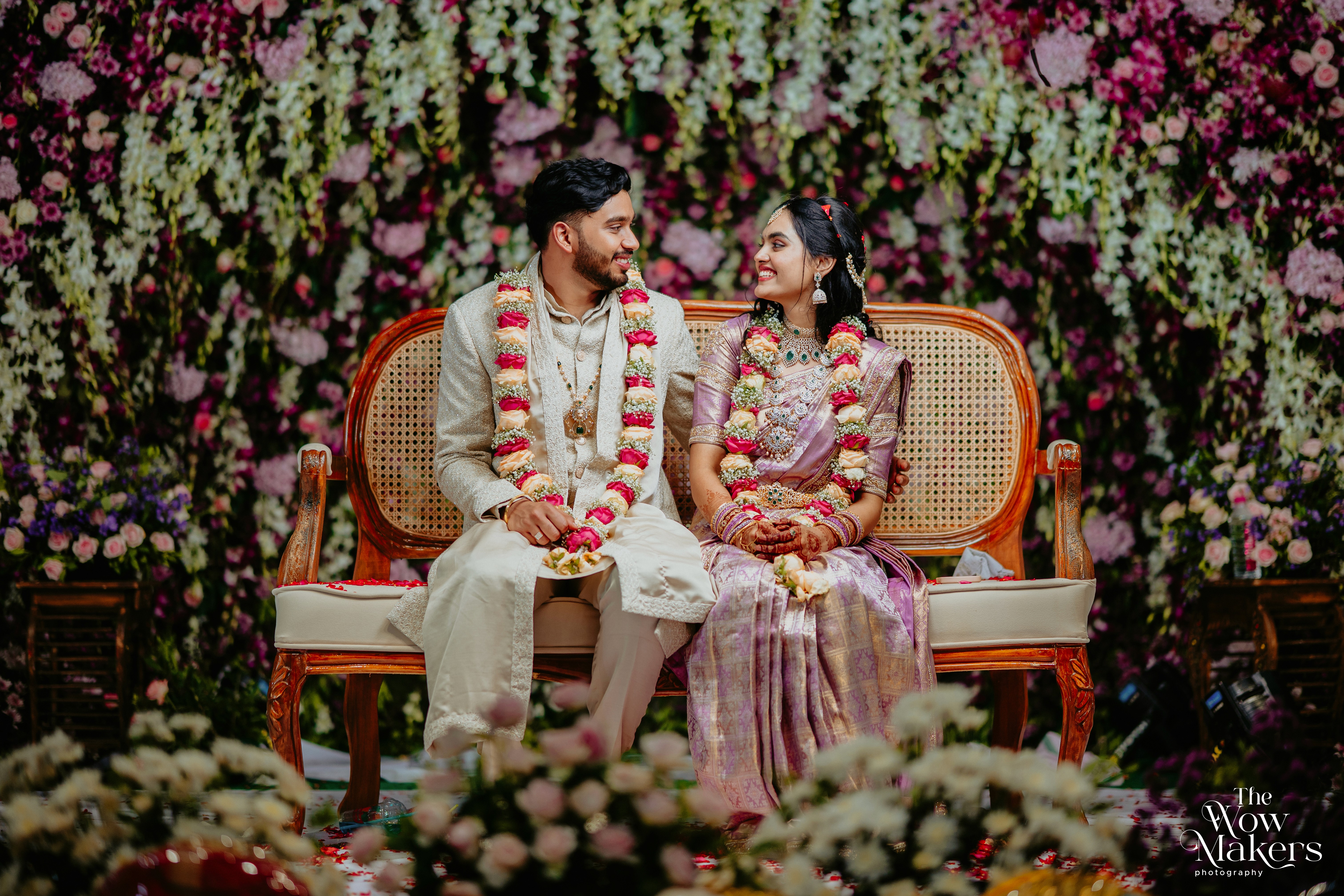 Engagement and blessing ceremony photo collage with floral backdrop, couple in ivory and pink traditional wear, by Wow Makers wedding photography in Hyderabad, India.