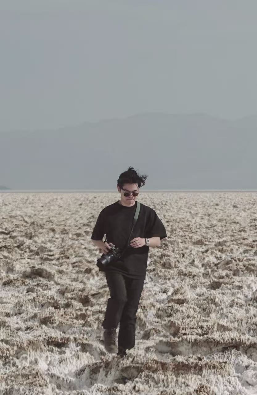 a blurry photo of a person standing in front of a wall