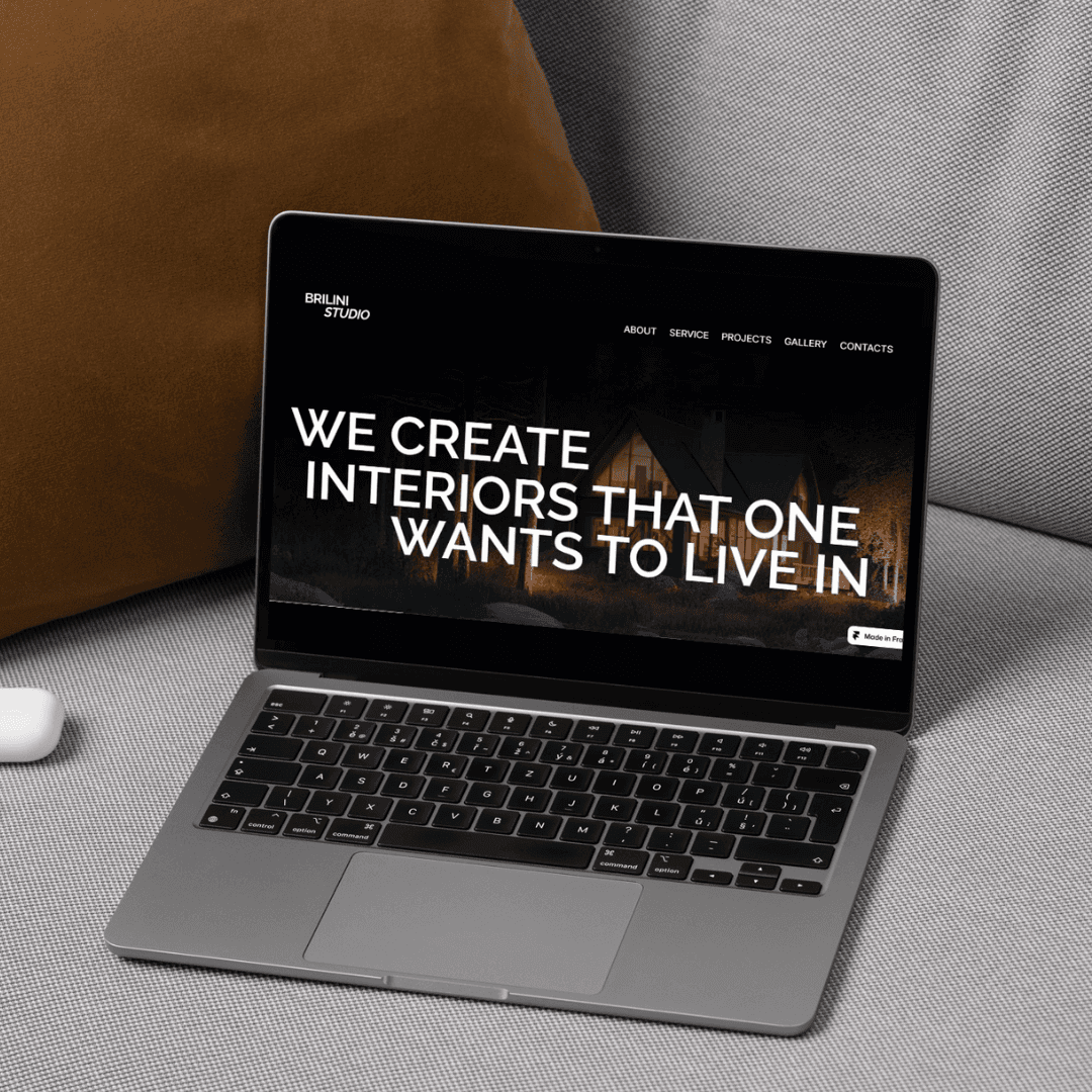 Red trolley car driving down a tree-lined street.