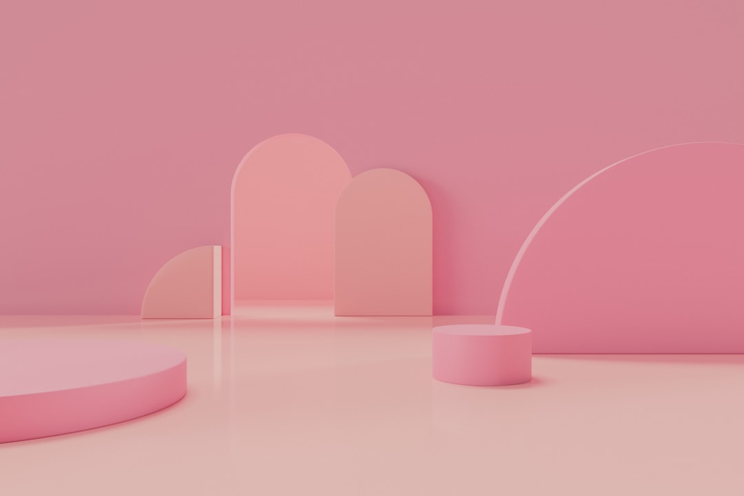 a pink room with arches and arches on the floor