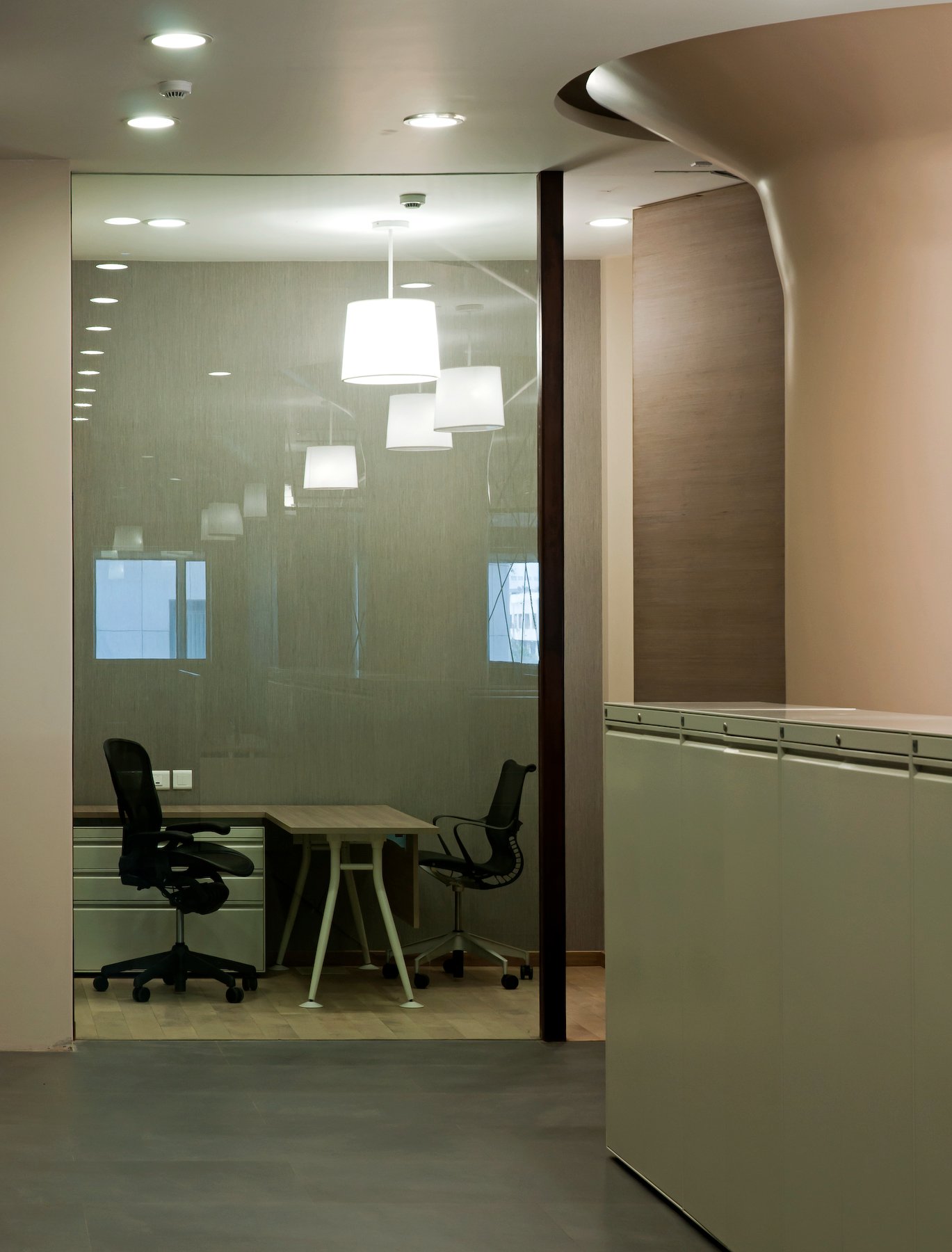 corporate office interior with meeting room and glass partitions