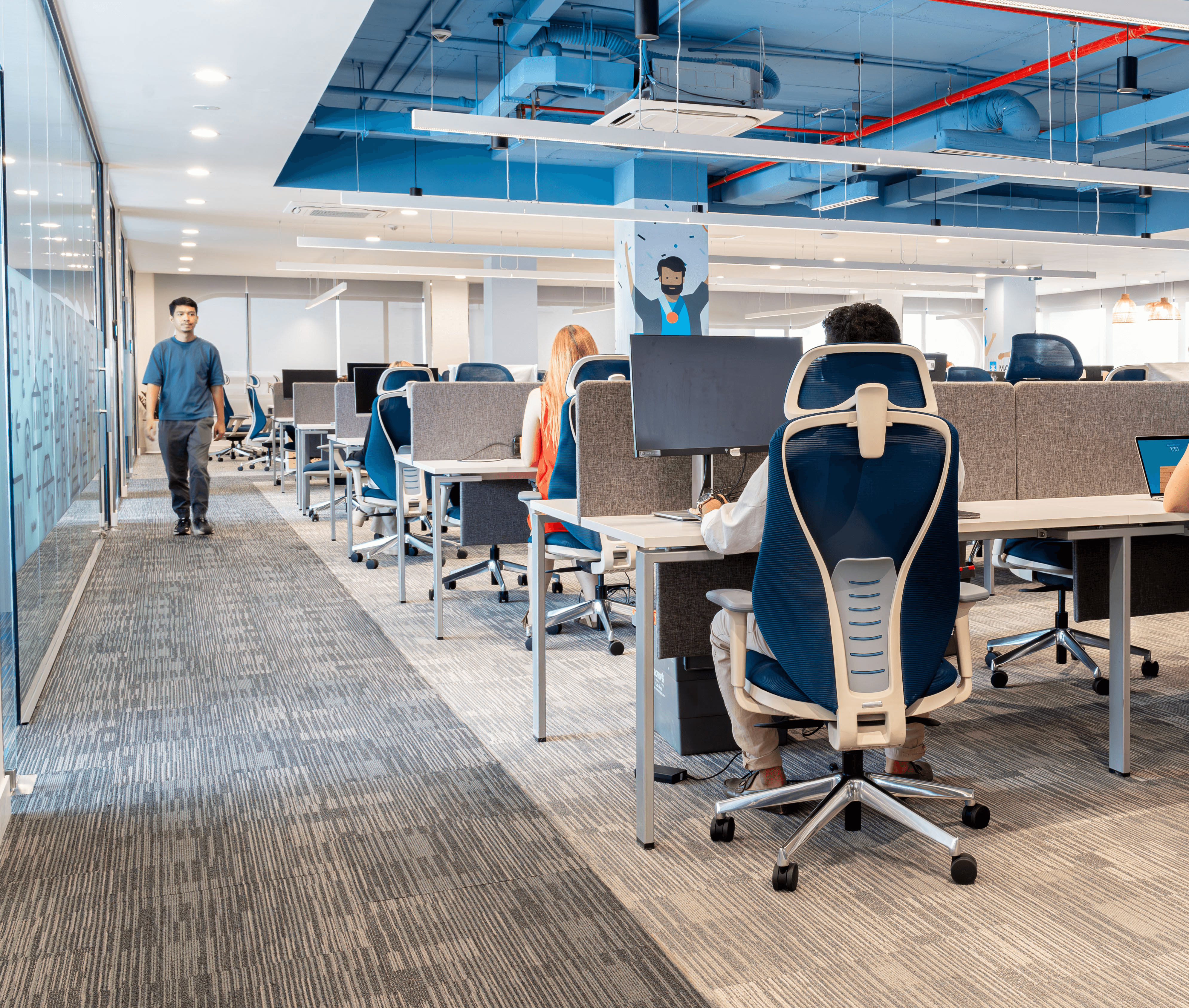 Open workstation layout with benching systems, ergonomic seating, and clear circulation paths optimized for operational efficiency