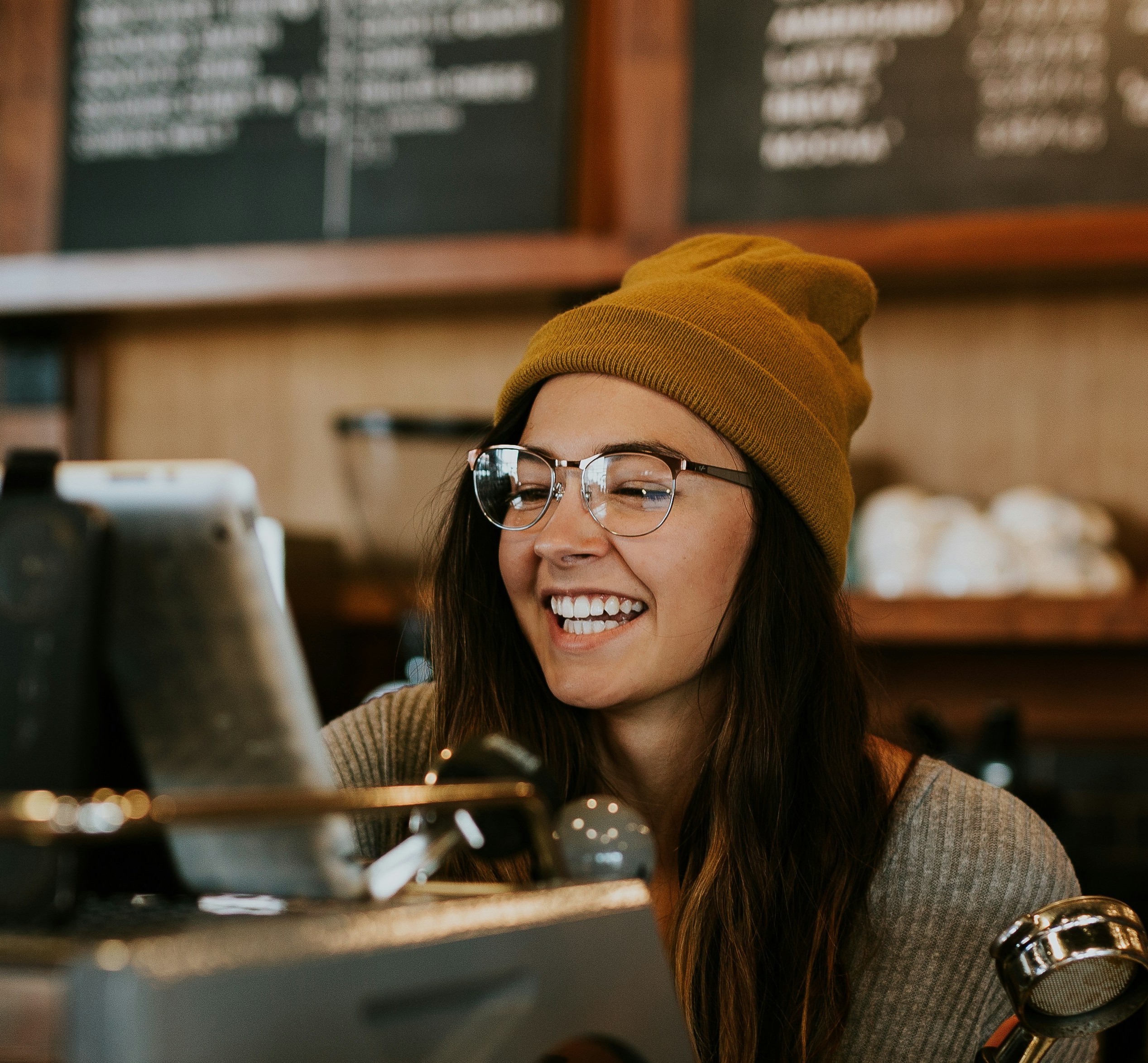 woman in black long sleeve shirt sitting on white couch