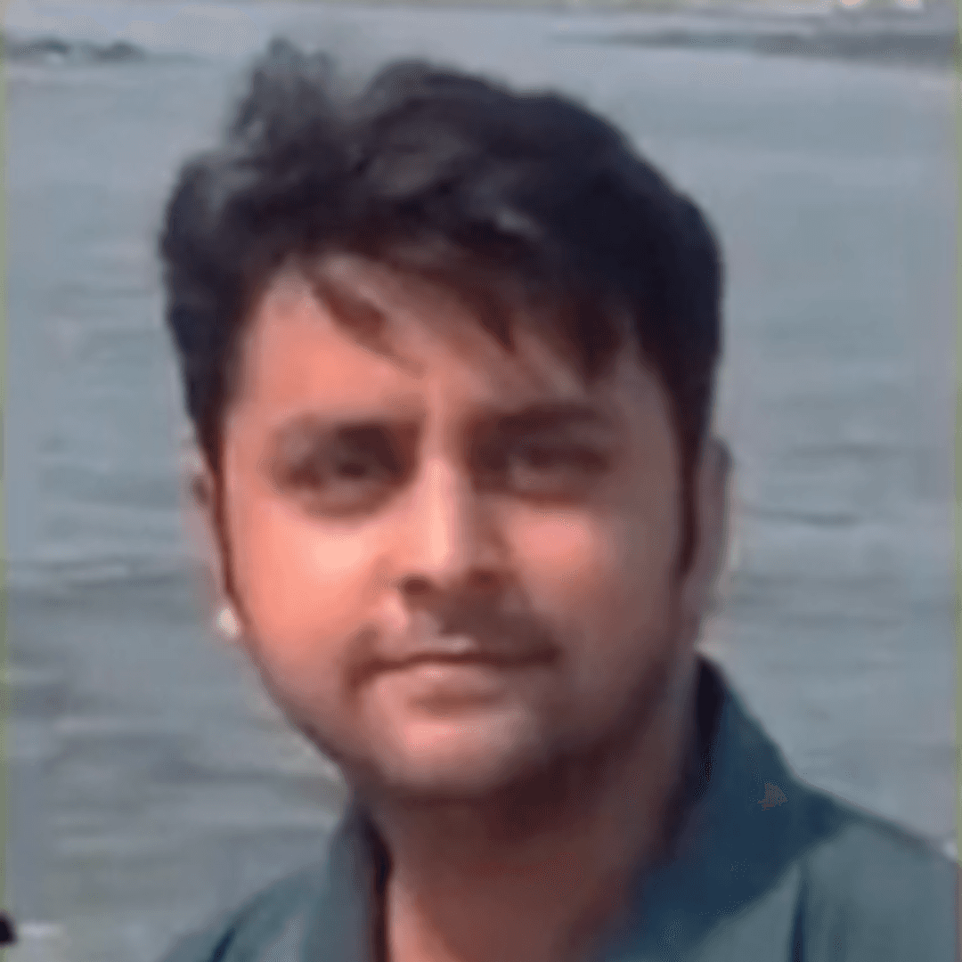 a person sitting at a table looking at the phone