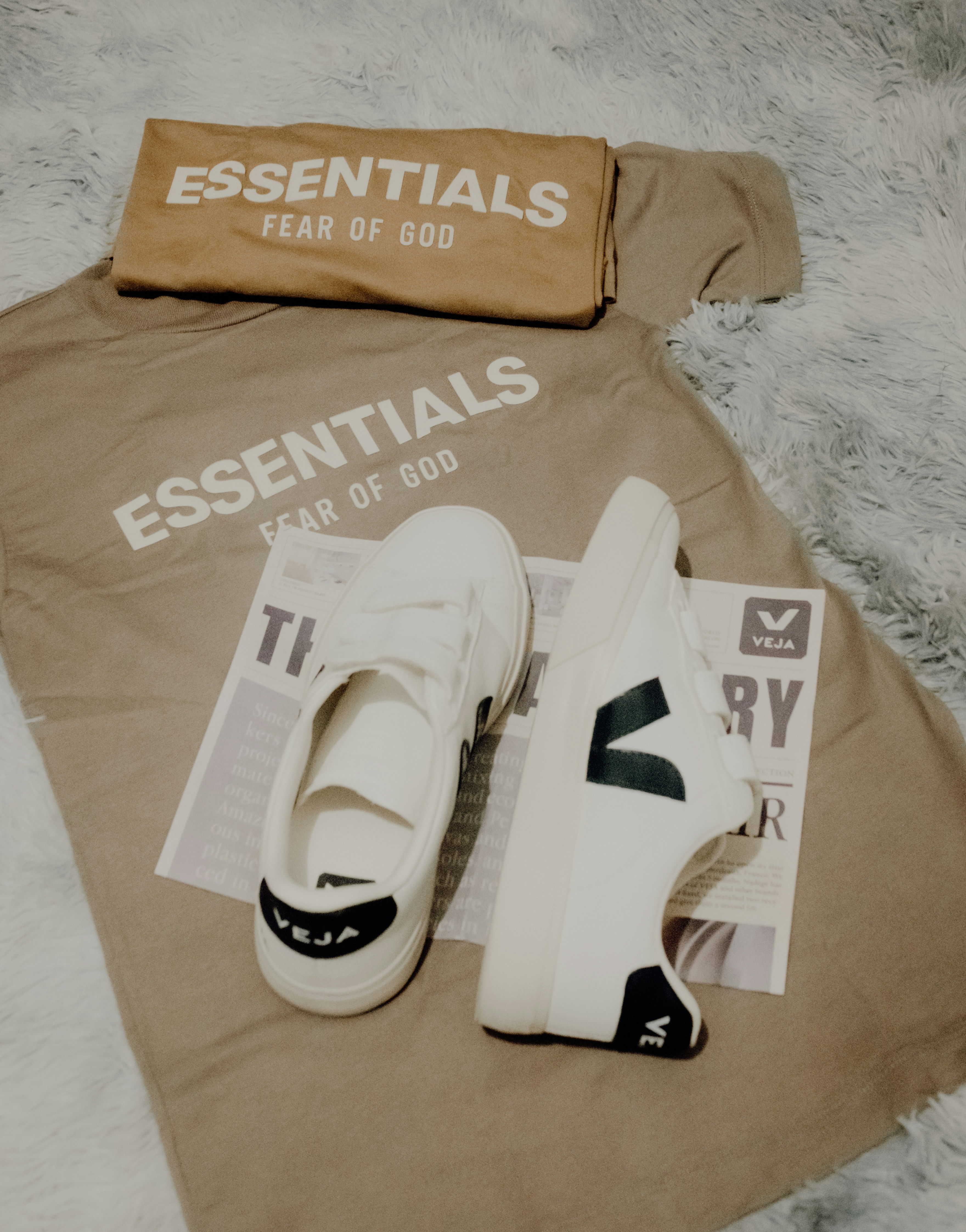 Essentials t-shirt and packaging with trainers