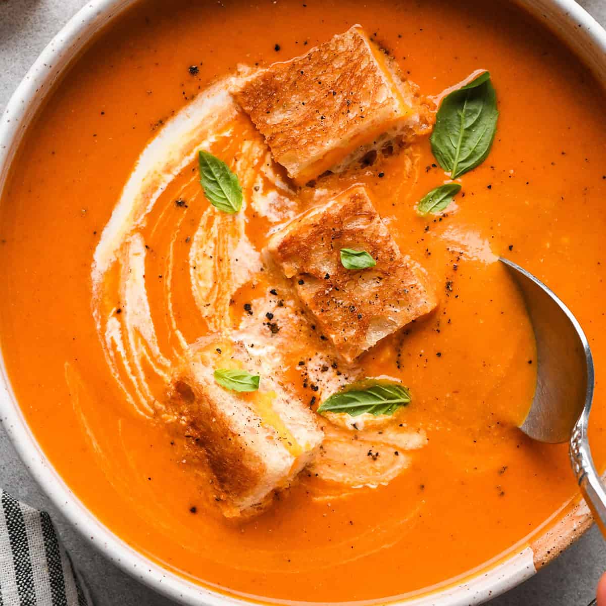 Tomato soup in a bowl with croutons