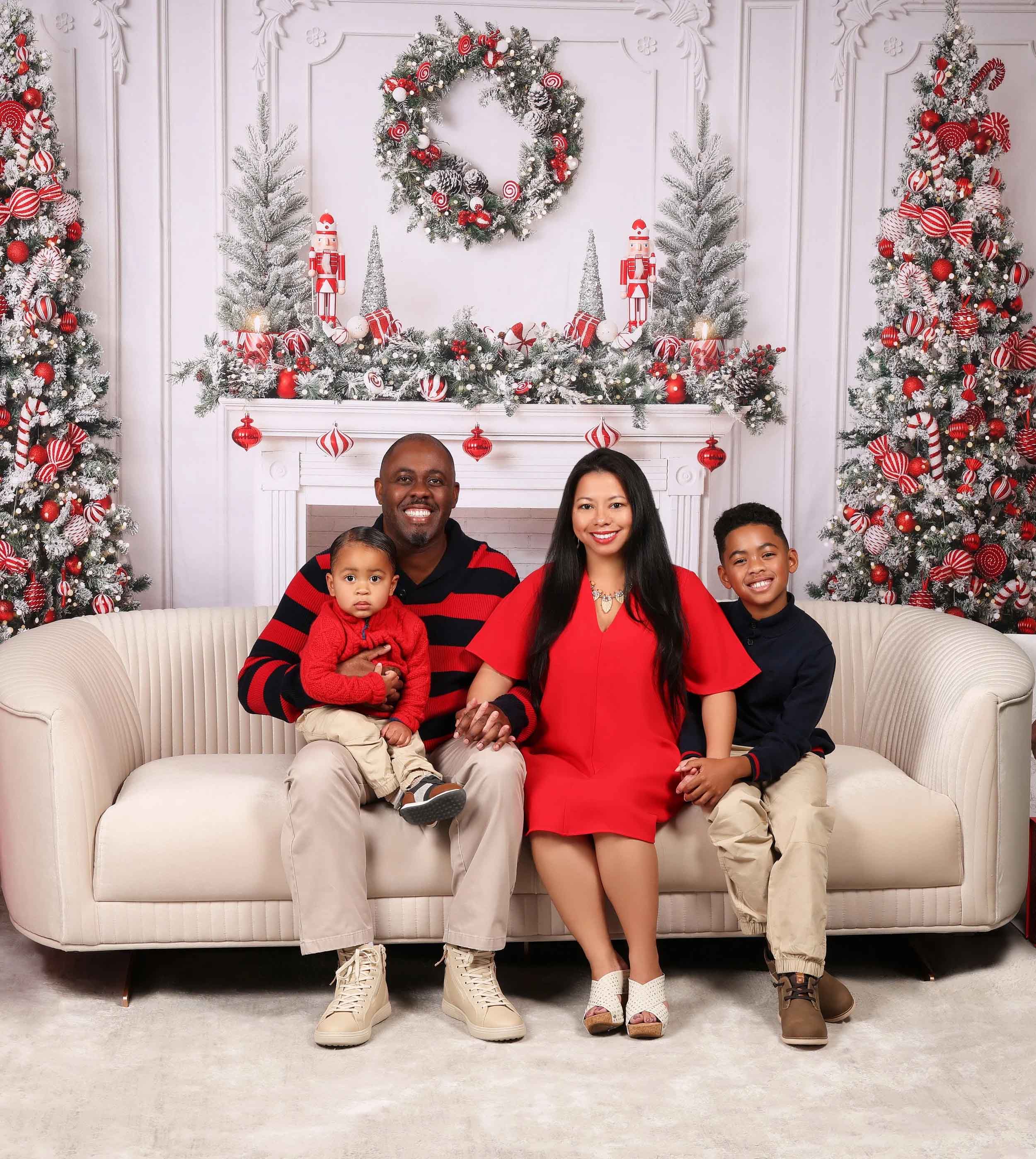 Holiday family portrait with a festive backdrop