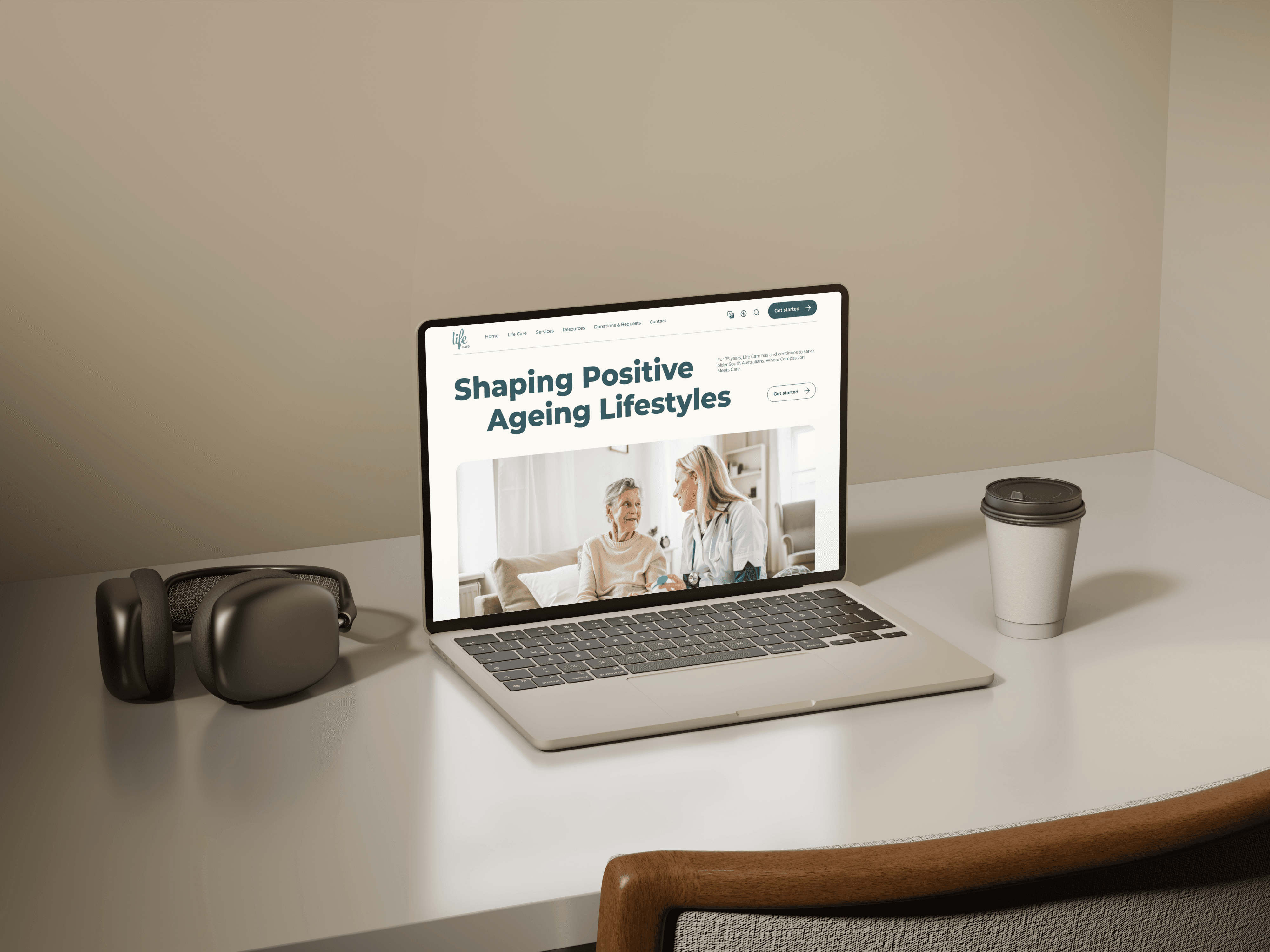 An open laptop on a desk, showing the Life Care website