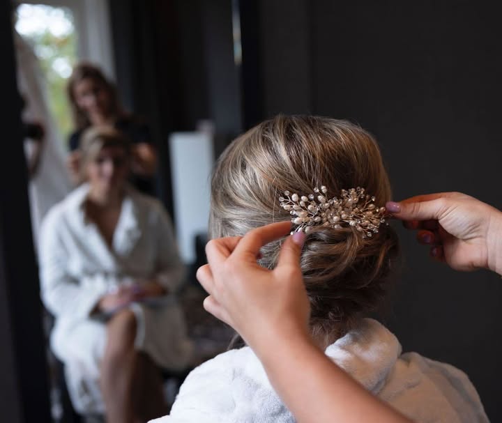 a woman in a dress sitting on a couch