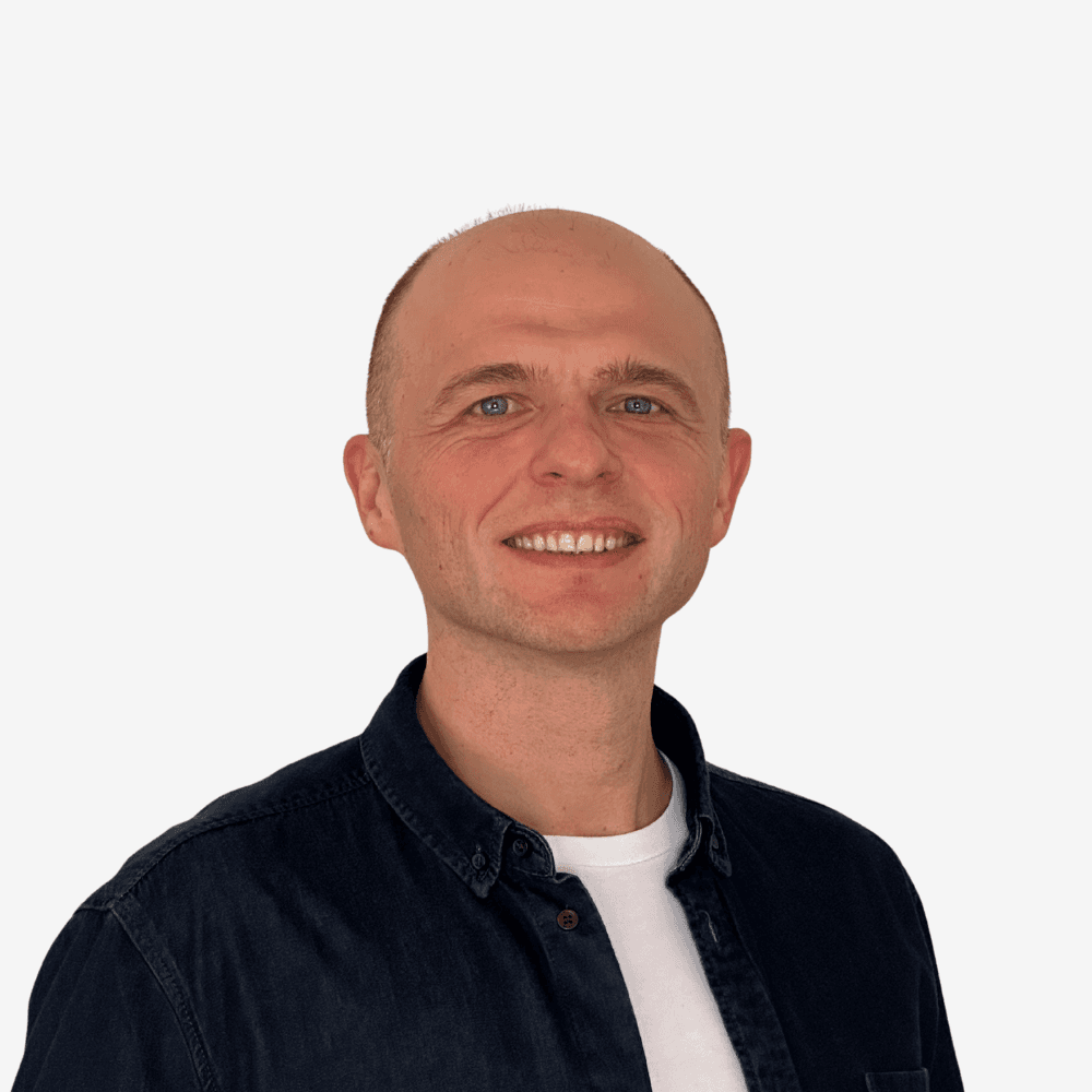 Founder wearing denim shirt