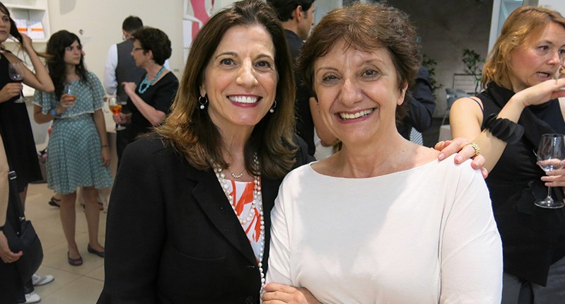 two women arms around sholders