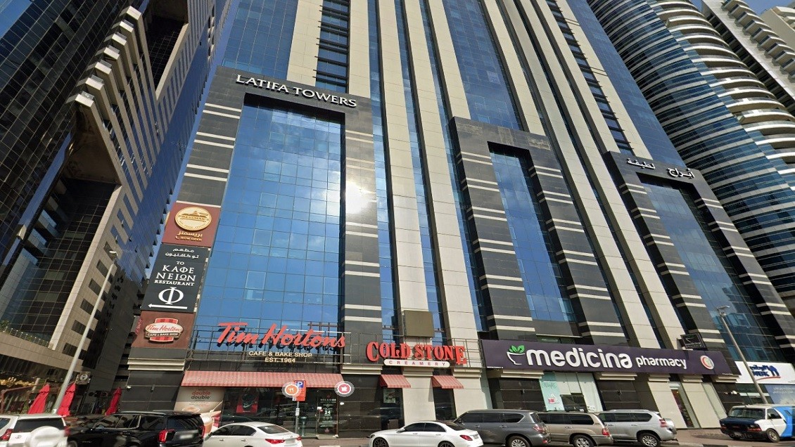 Night view of Burj Khalifa and Dubai Fountain from a luxury balcony in Dubai.