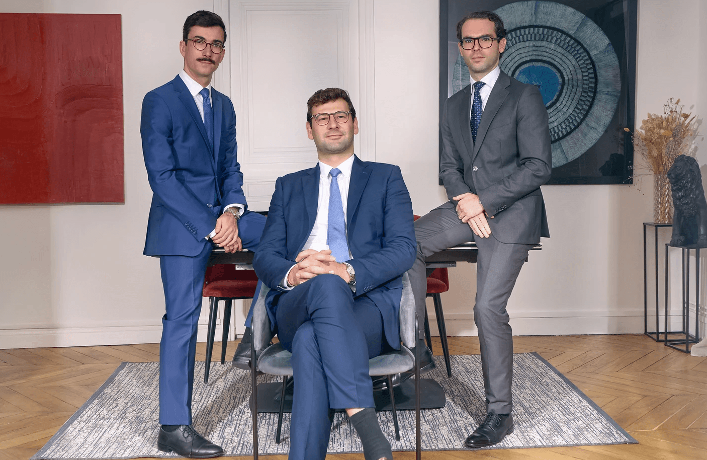 woman sitting around table holding tablet