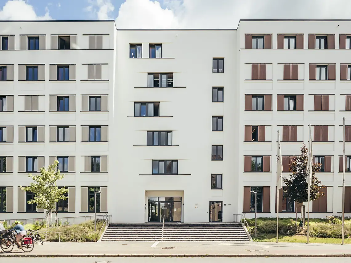 Exterior of student accommodation in Göttingen, Germany with modern residential building and bicycle access