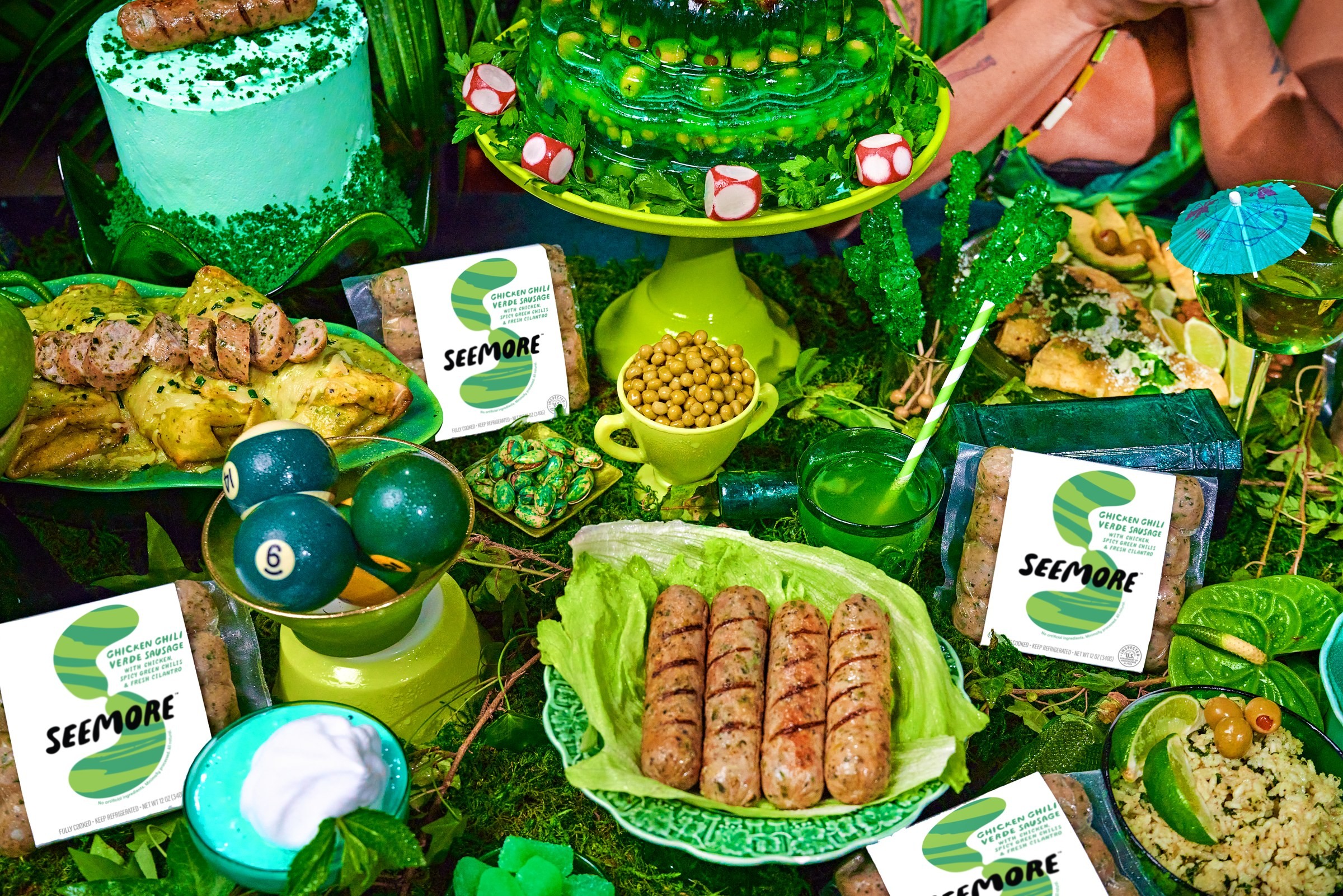 Salsa Verde sausages and packaging among green dishes and food props