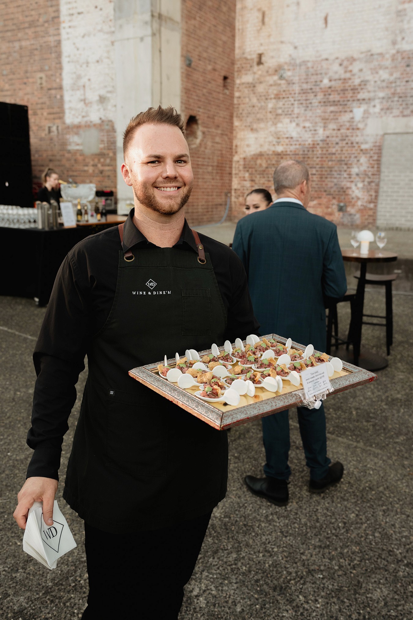 Front of House staff serving canapes at the Brisbane Powerhouse