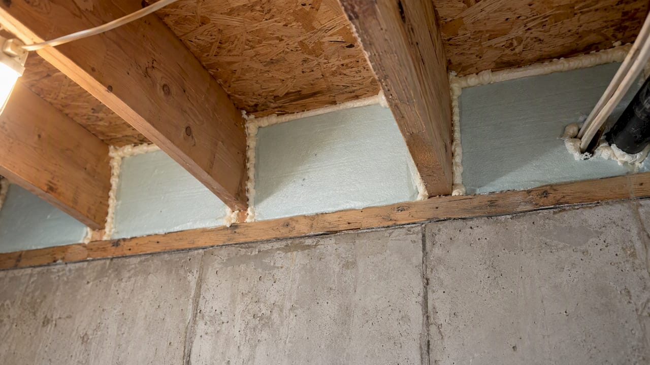 Foam-sealed rim joist bay and penetrations