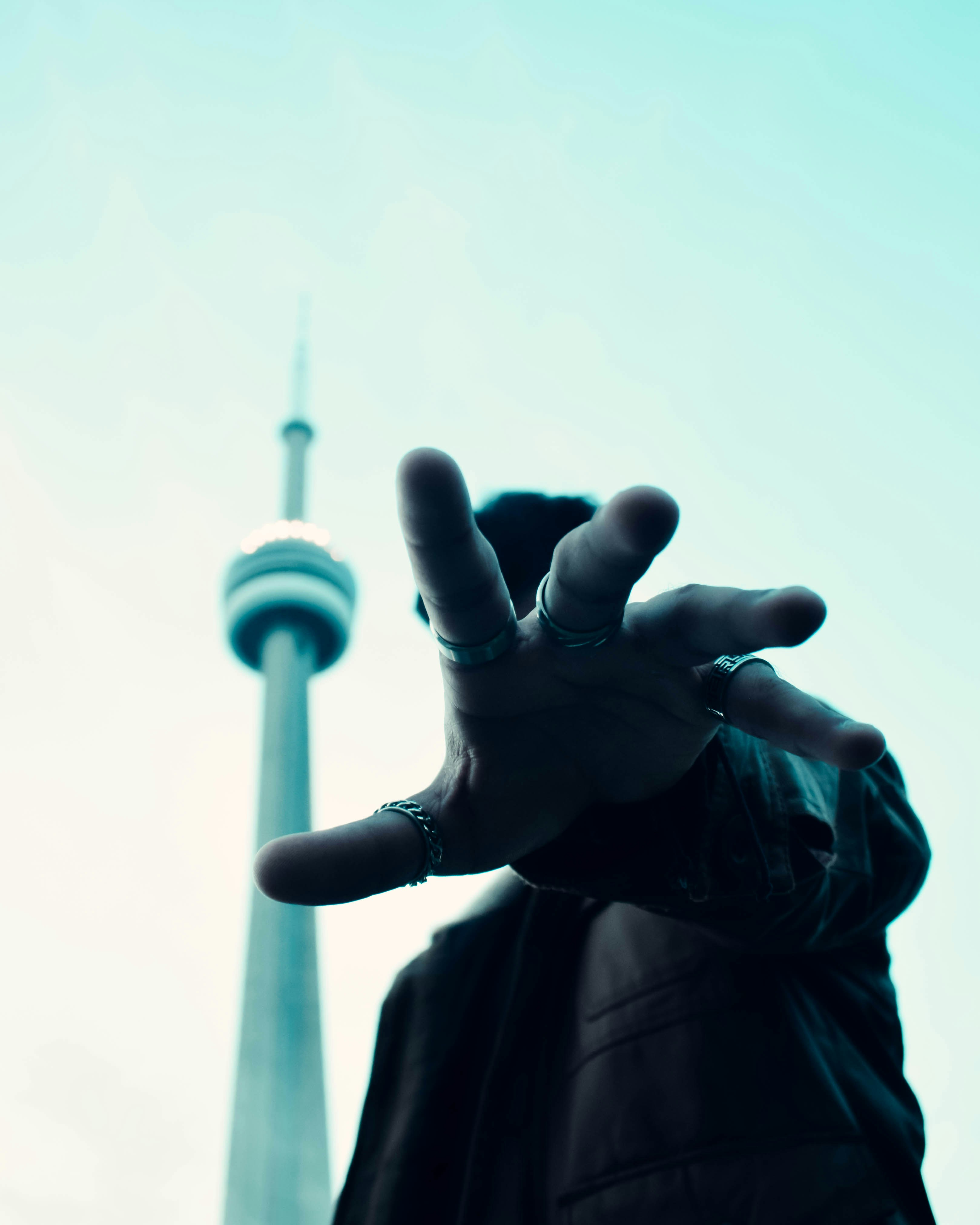 a person making a peace sign with their hand