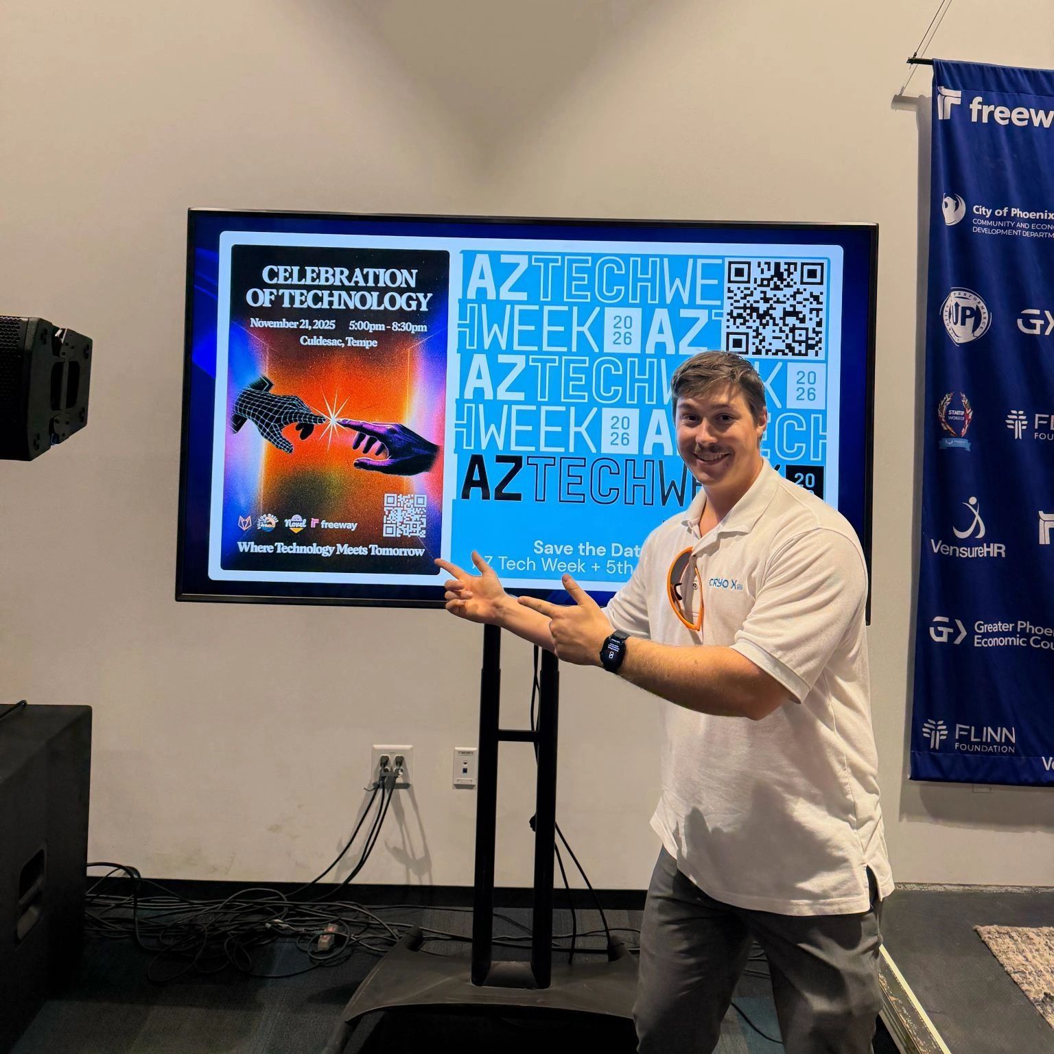 a black and white living room with a large tv