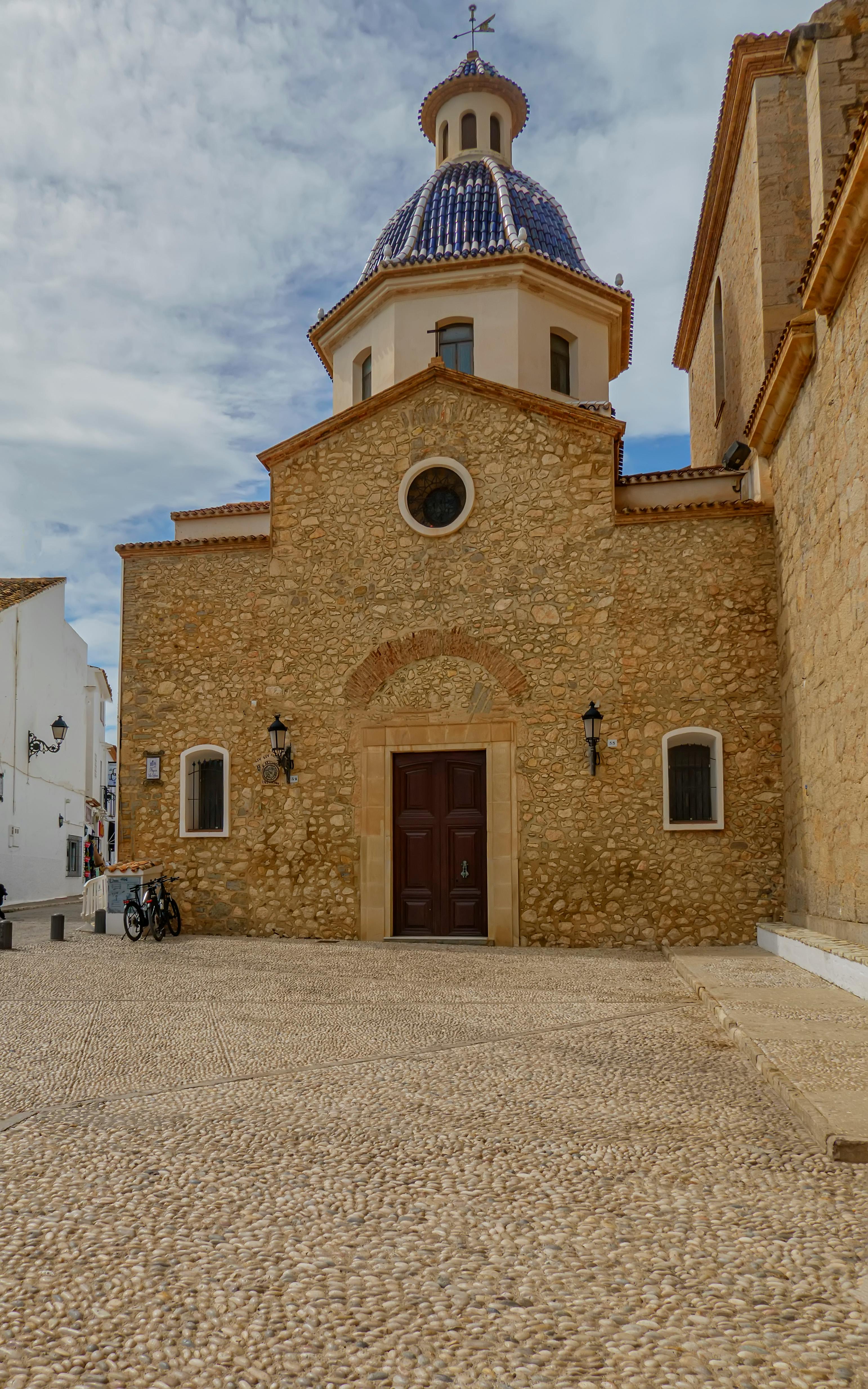 City buildings seen through a sunlit window.