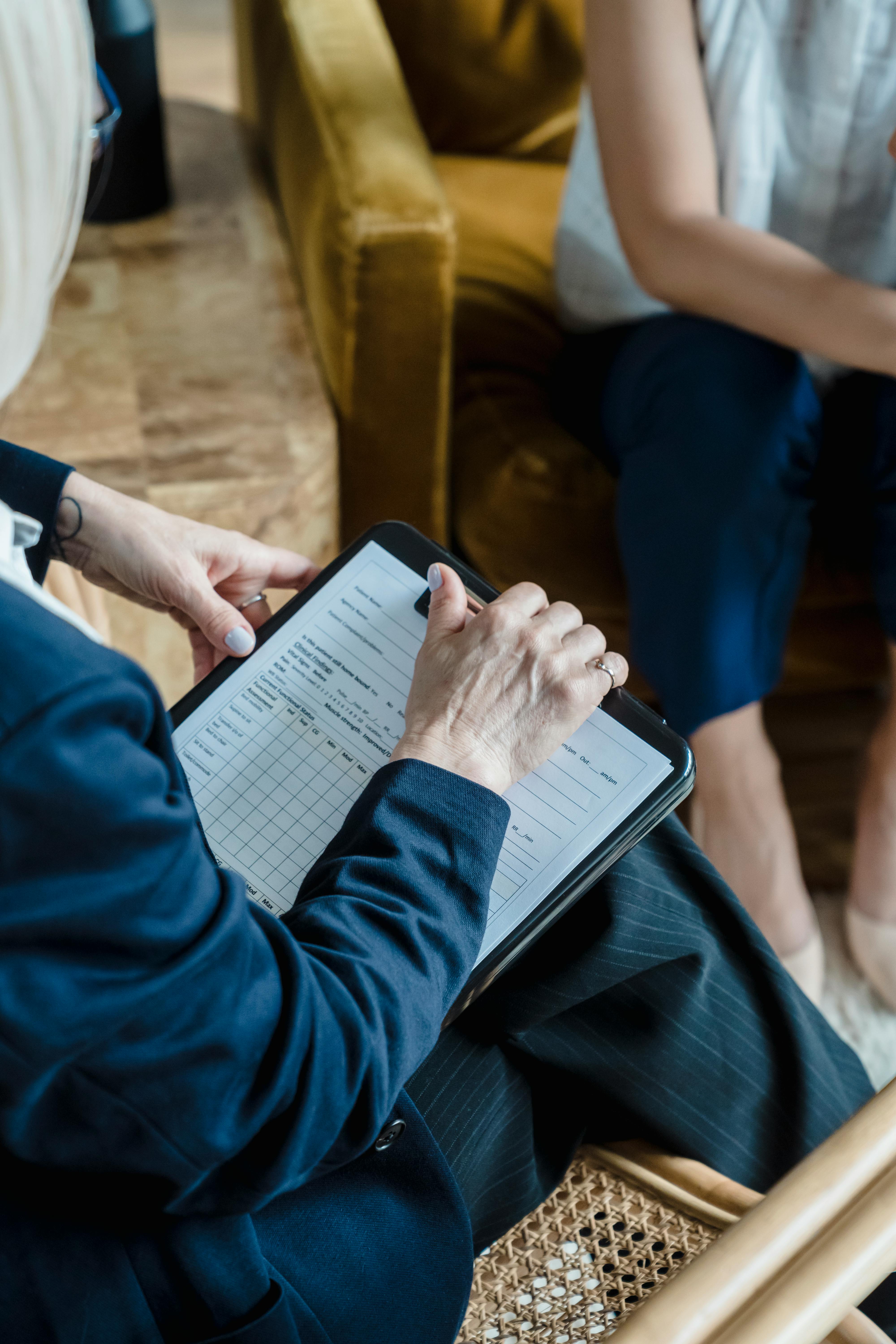 hands-holding-a-clipboard-in-a-professional-setting-during-a-counseling-session. - timur-weber (pexels)