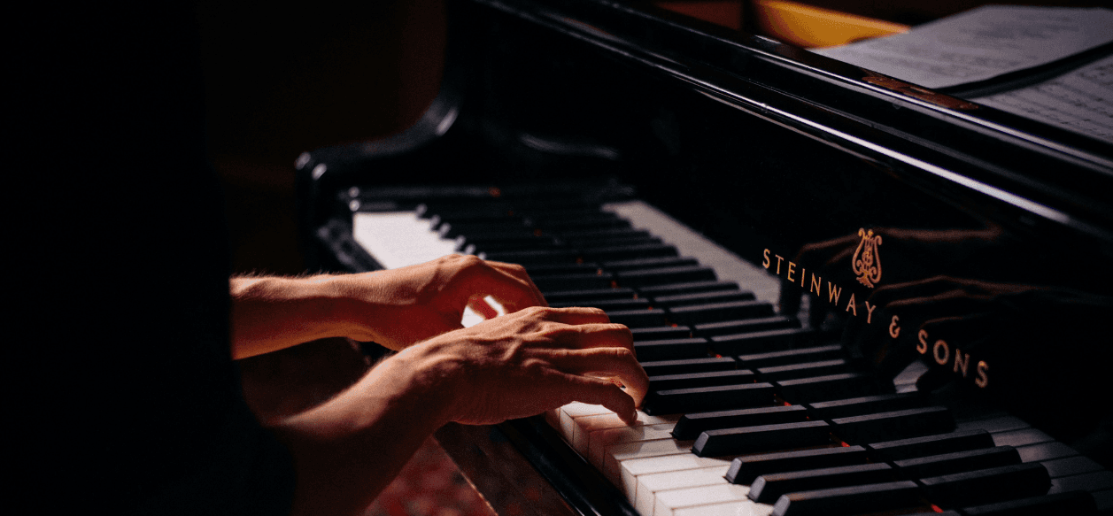 Hands playing piano