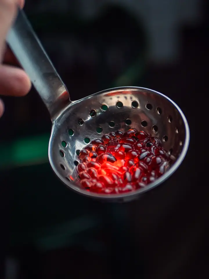 A man and a woman sitting at a bar