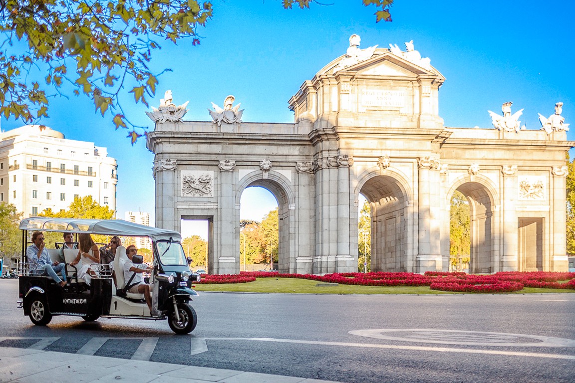 Eco Tuk Tuk tour in Lisbon, Portugal, showcasing vibrant city streets and historic architecture.