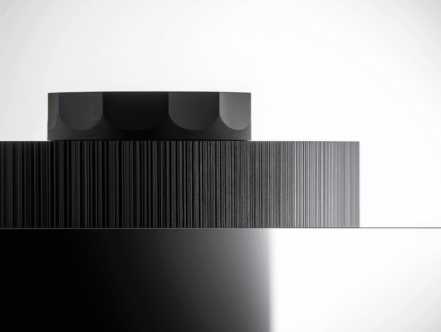 Black and white photo featuring a monochrome object, emphasizing its shape and texture in a minimalist style.