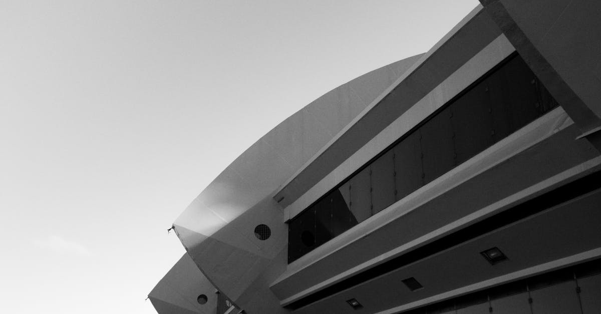 Dynamic black and white photo showcasing a modern architectural facade in Montreal's urban landscape