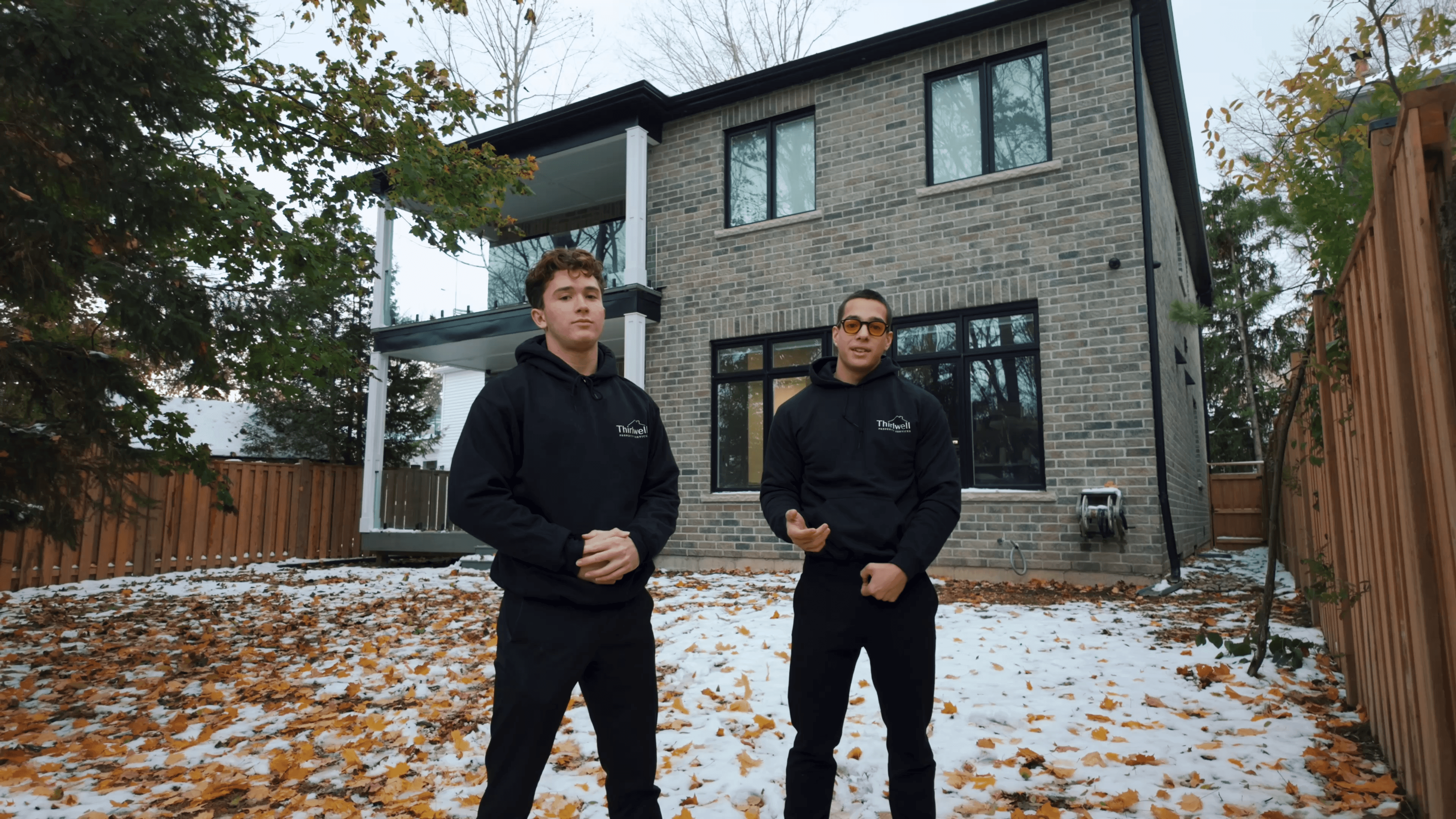Thirlwell Property Services founders Frost and Dara Thirlwell in front of a Toronto home