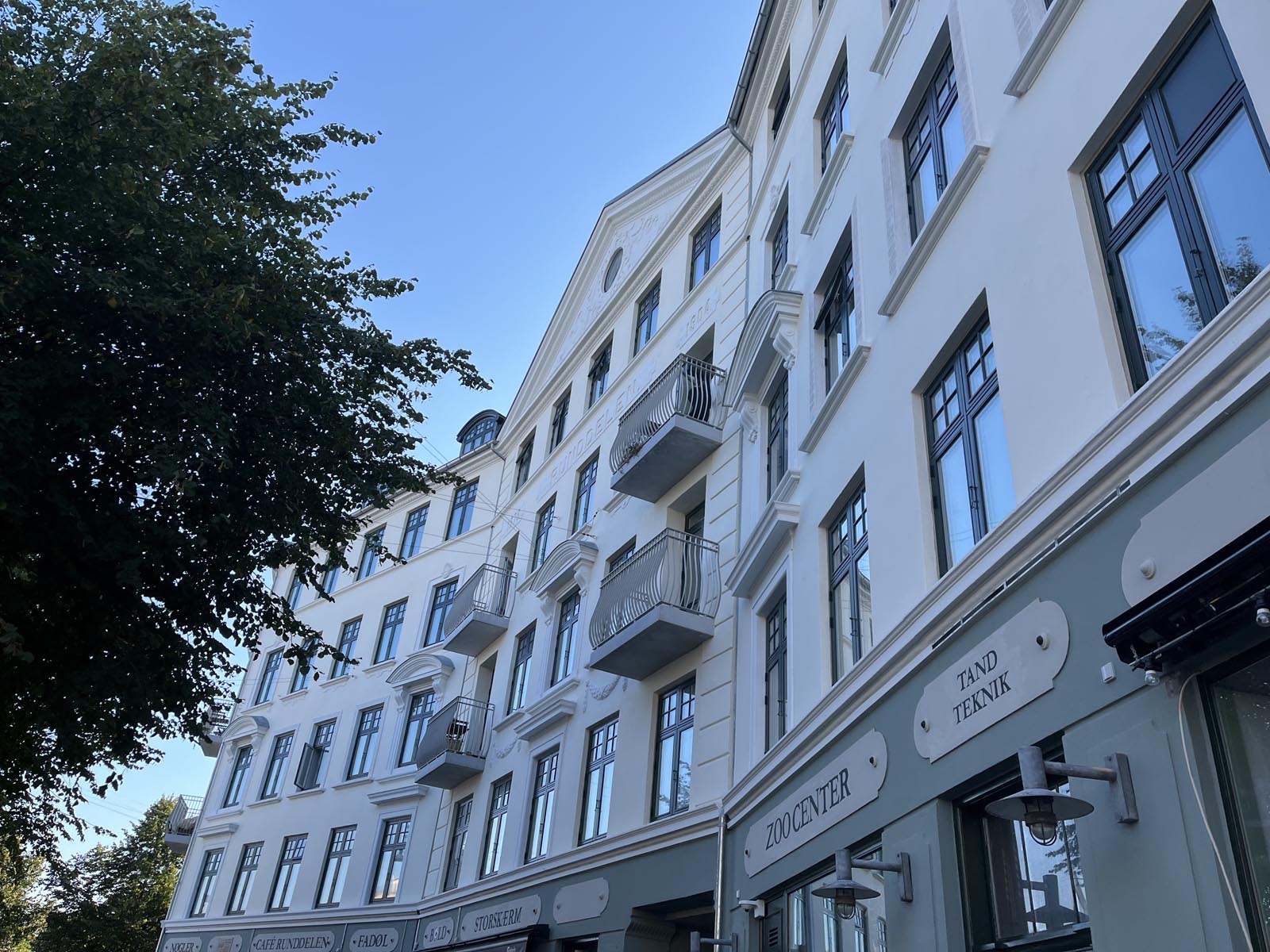 cars on road near buildings during daytime
