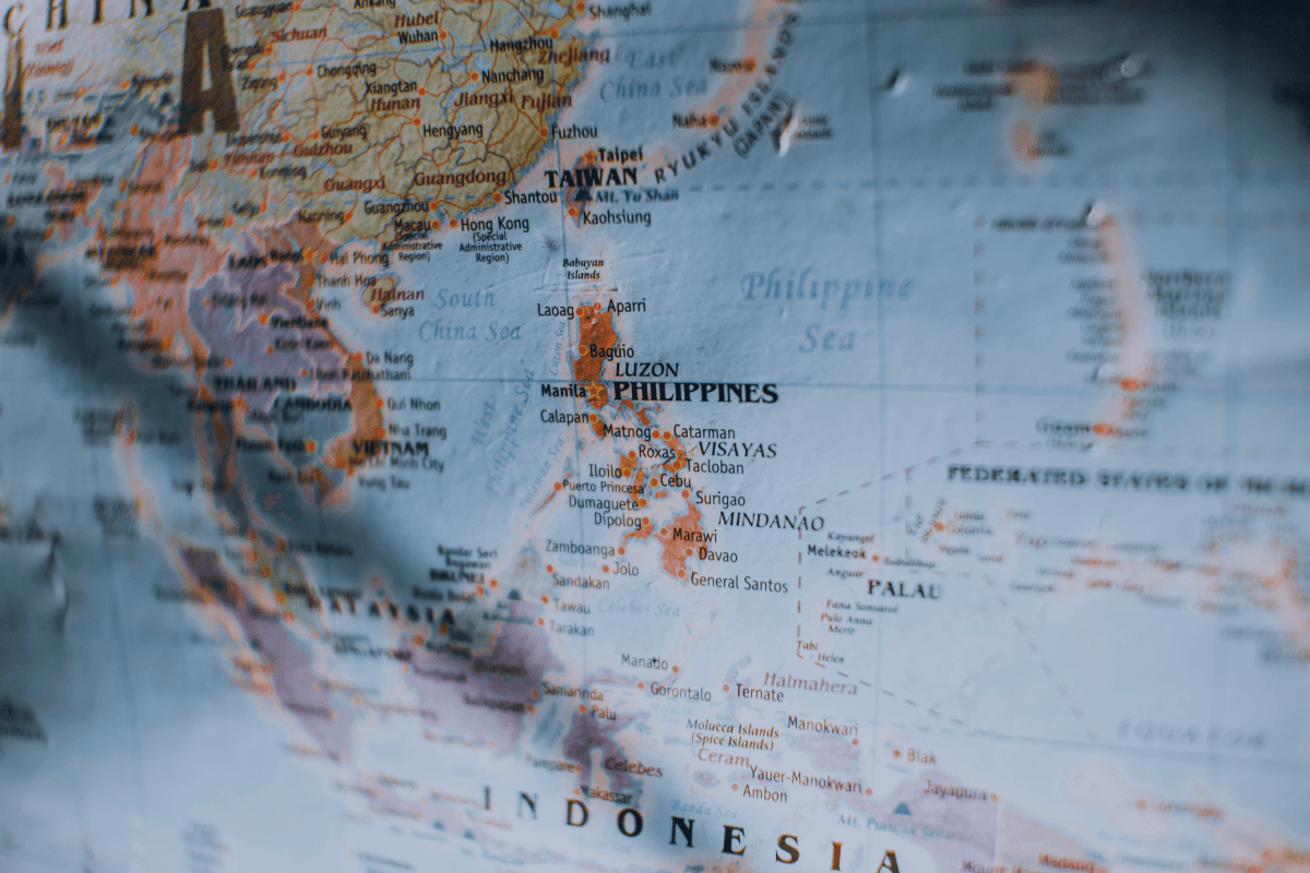 Minimal world map background representing global mobility and strategic citizenship planning.