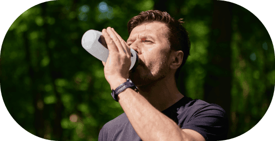 A man hydrating after his workout routine