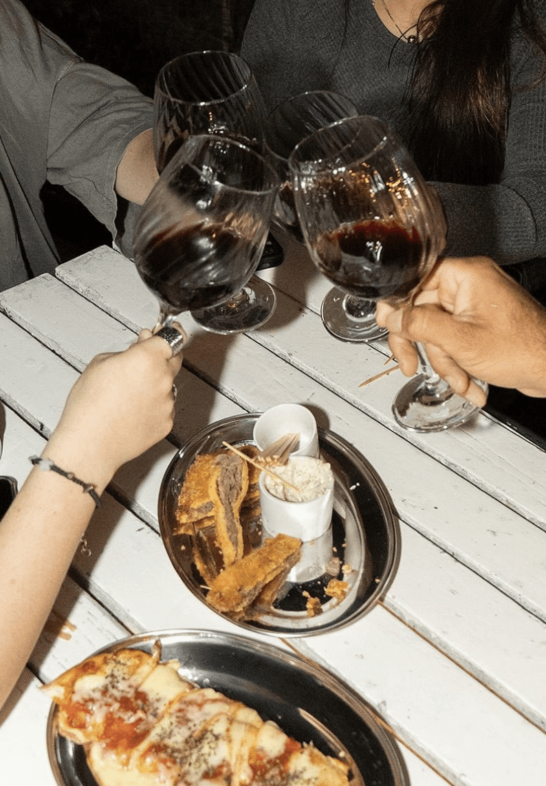a cappuccino sitting on top of a wooden table