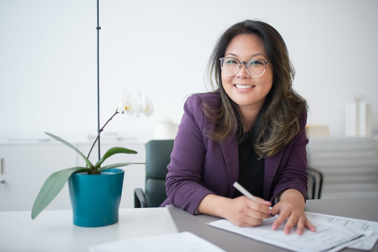 Smiling woman writing notes