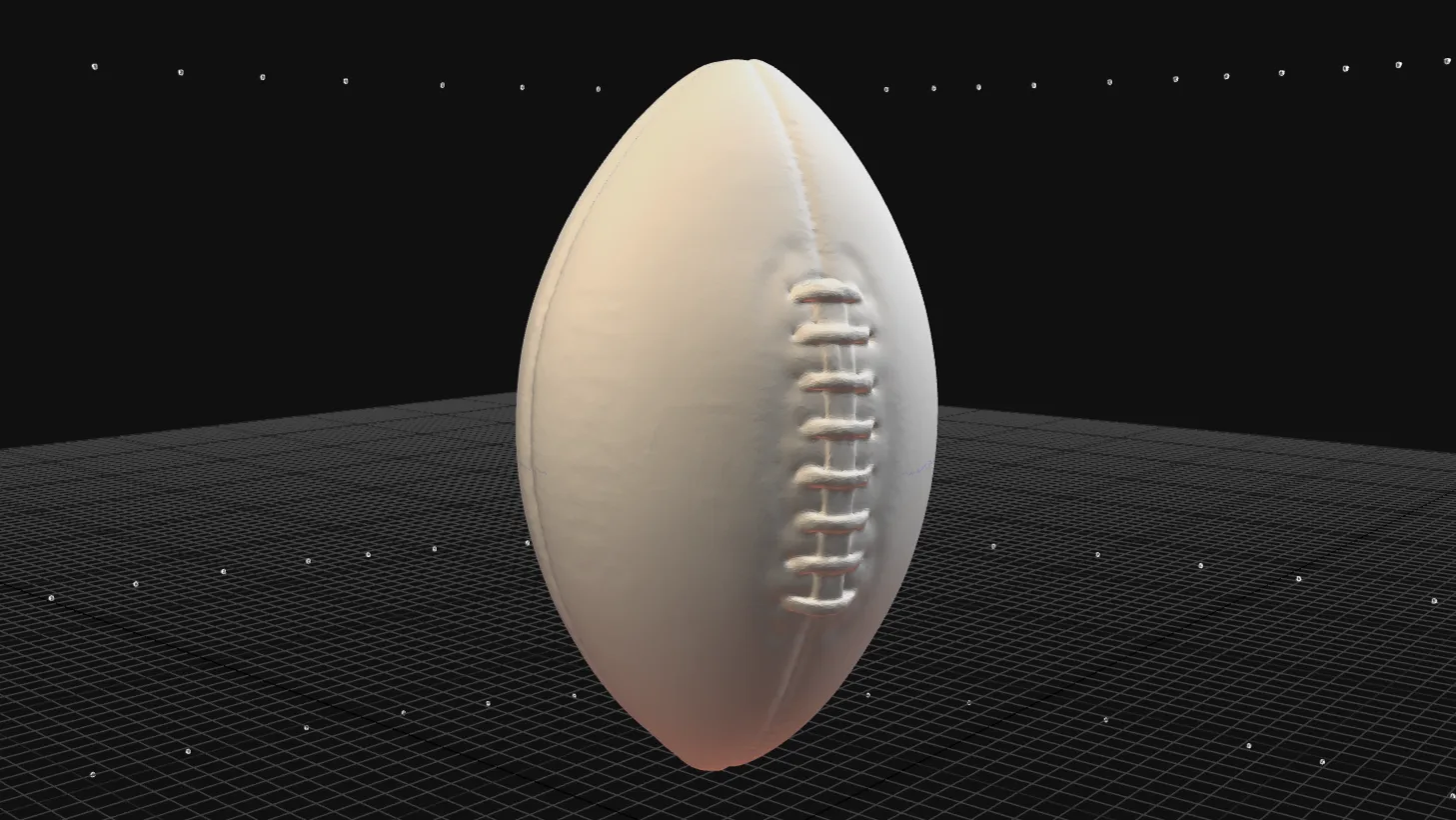 Smoothed mesh of the football model, with no fine details visible.